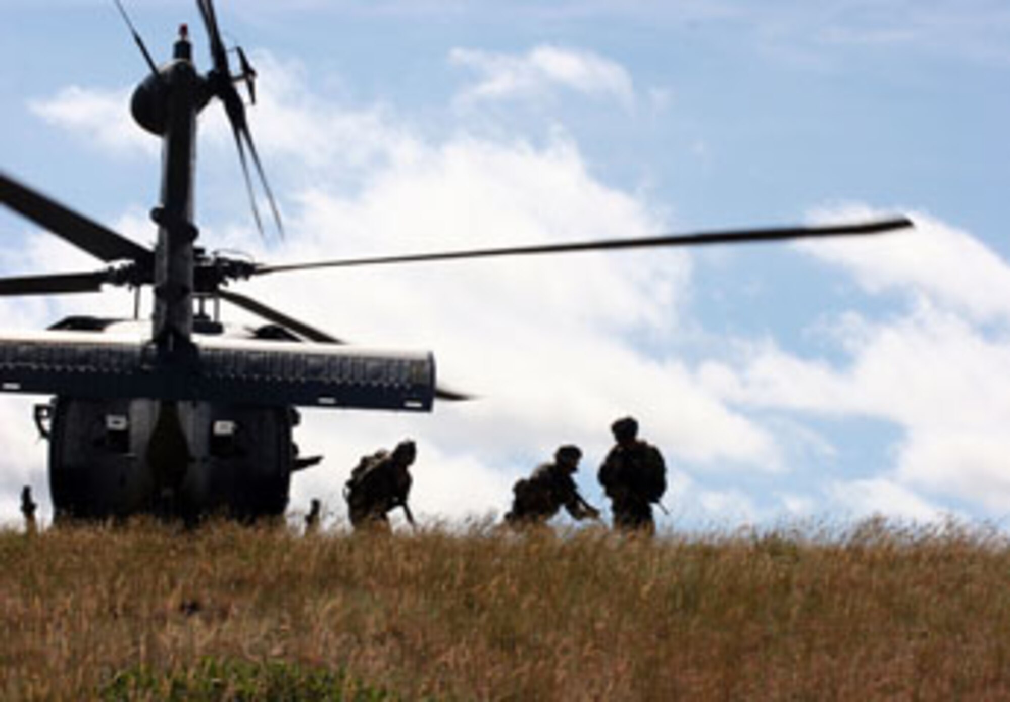 Pararescuemen from the 304th Rescue Squadron, Portland, Ore. deploy from a 305th Rescue Squadron, Davis-Monthan Air Force Base, Ore. HH-60 Pavehawk helicopter June 9, 2007 to practice mountain rescue skills used in contingencies operations.  Although geographically separated both squadron's are subordinate units of the 943rd Rescue Group located at Davis-Monthan Air Force Base, Ariz.  (U.S. Air Force Photo/Ruby Zarzyczny)