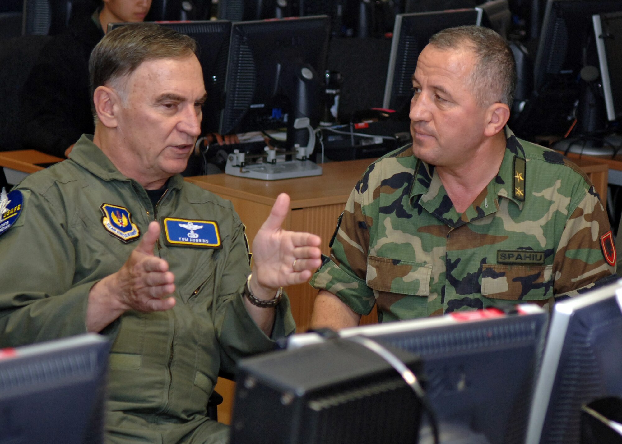 Gen. Tom Hobbins, Commander U.S. Air Forces in Europe, and Brig. Gen. Shpetim Spahiu, Albanian Joint Forces Commander, discuss air security procedures to protect President George W. Bush during his visit to Albania. (U.S. Air Force photo/Airman 1st Class Marc Lane) 
