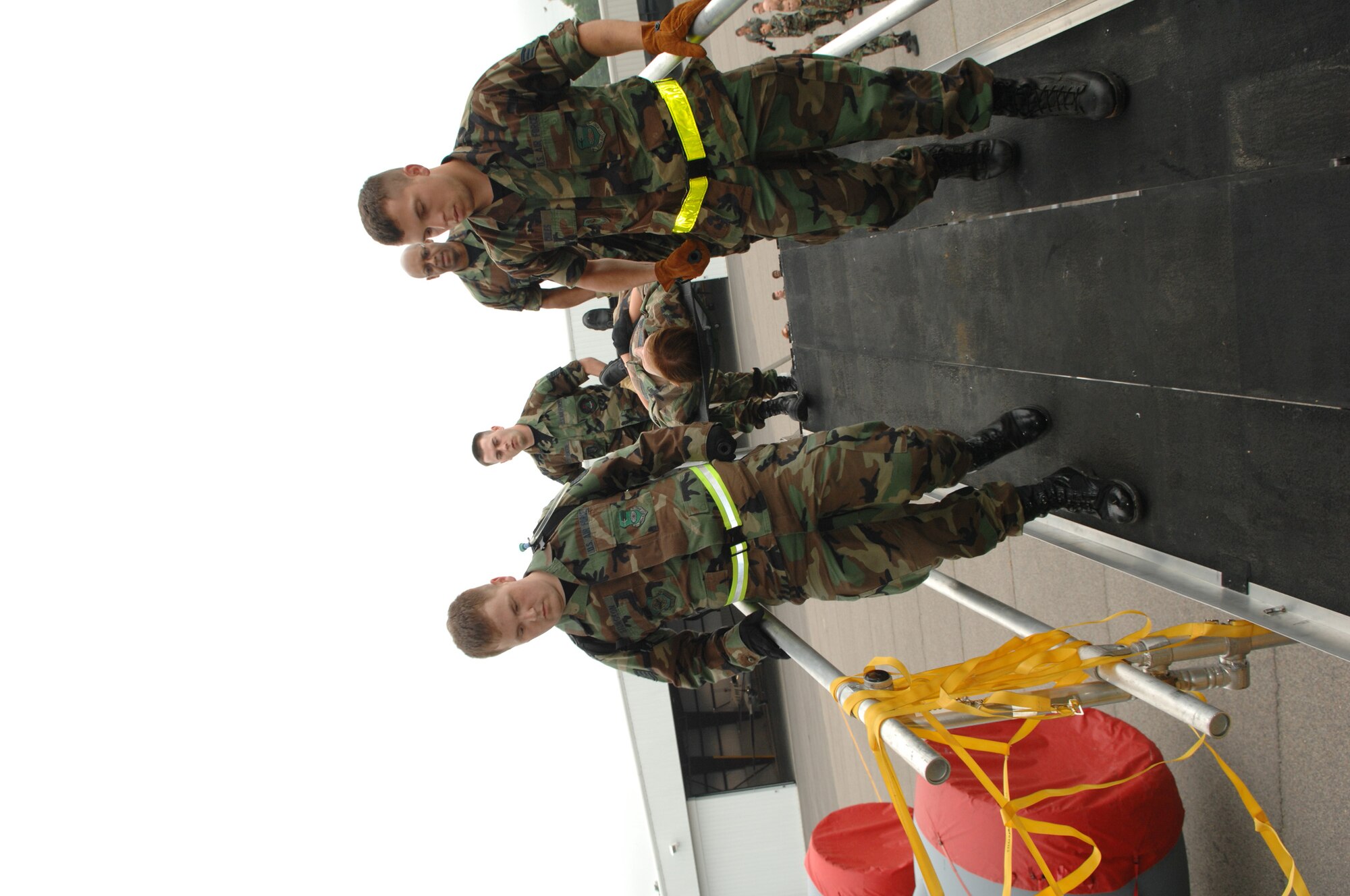 U.S. Air Force medical personnel in-plane a simulated wartime casualty from a patient loading system into a KC-135 Stratotanker at Golden Medic at Augusta Regional Airport-Bush Field, Ga. on June 12, 2007. Golden Medic is a yearly medical exercise sponsored by the U.S. Army Reserve designed to provide a realistic training experience to participating combat support and service support units, while enhancing the overall training and readiness of Army Reserve and Air Force medical units. (U.S. Air Force photo by Senior Airman Erica J.Knight)(RELEASED)