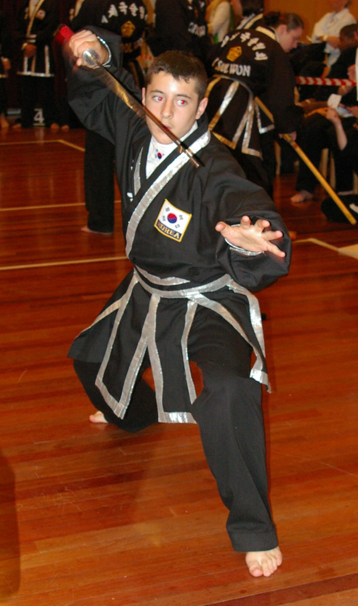 Three-time grand champion Dylan Mejia performs the sword form for a gold medal at the European championships. Dylan is one of Aviano’s junior black belt instructors. 
Kuk Sool Won classes are from 6 to 7:30 p.m. Tuesdays and Thursdays for children and 7:30 to 9:30 p.m. for adults in the Aviano Elementary School gym.  For more information on Aviano’s KSW, visit www.kuksoolwonitaly.com.  (Photo courtesy Aviano Kuk Sool Won)

