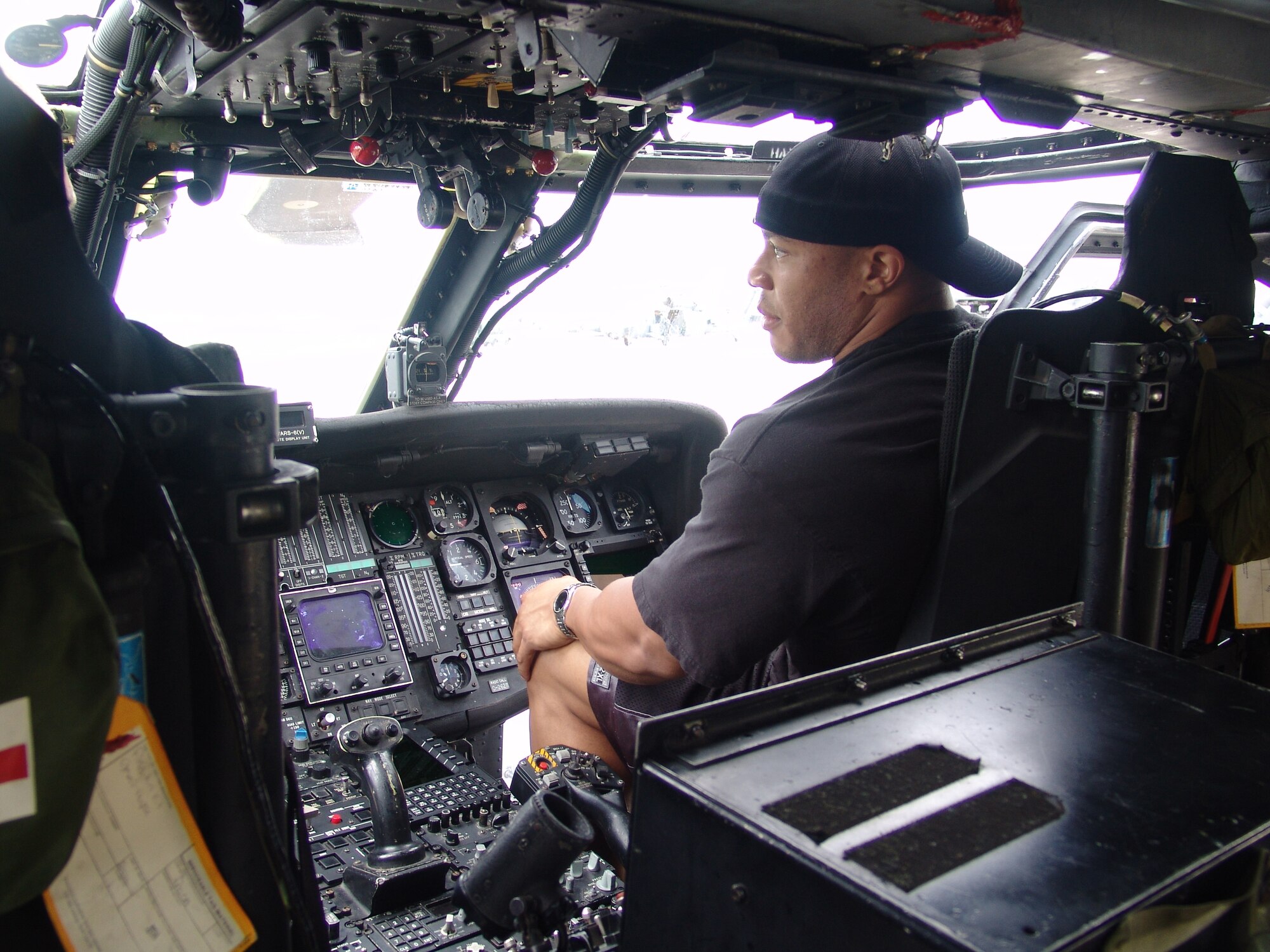 Phil Heath checks out the controls of a HH-60G rescue helicopter while touring 33rd Rescue Squadron June 8. Mr. Heath was the guest poser at the 2007 Pacific Muscle Classic held at Kadena Air Base, Japan, June 10. 
(U.S. Air Force courtesy photo)