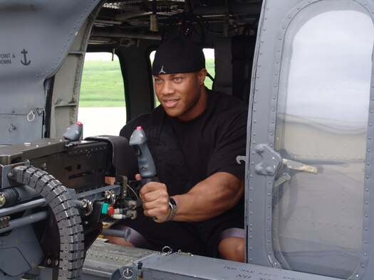 Phil Heath checks out a .50-Caliber machine gun during his tour of the 33rd Rescue Squadron June 8. Mr. Heath was the guest poser at the 2007 Pacific Muscle Classic held at Kadena Air Base, Japan, June 10. 
(U.S. Air Force courtesy photo)           