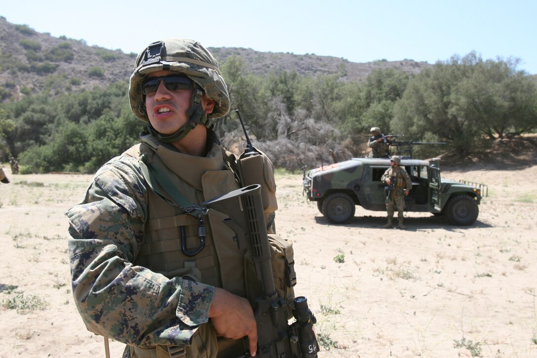 FIRE BASE GLORIA, MARINE CORPS BASE CAMP PENDLETON, Calif. ?Marines with Weapons Company, Battalion Landing Team 1st Battalion, 5th Marine Regiment, 11th Marine Expeditionary Unit participate in a tactical recovery of aircraft and personnel (TRAP) exercise June 14, here. The Marines with the BLT were engaged with a mock CH-46E Sea Knight helicopter accident and the recovery and evacuation of the personnel on board. The training was provided by Special Operations Training Group, I Marine Expeditionary Force.