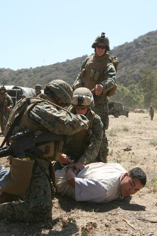 FIRE BASE GLORIA, MARINE CORPS BASE CAMP PENDLETON, Calif. ?Marines with Weapons Company, Battalion Landing Team 1st Battalion, 5th Marine Regiment, 11th Marine Expeditionary Unit participate in a tactical recovery of aircraft and personnel (TRAP) exercise June 14, here. The Marines with the BLT were engaged with a mock CH-46E Sea Knight helicopter accident and the recovery and evacuation of the personnel on board. The training was provided by Special Operations Training Group, I Marine Expeditionary Force.