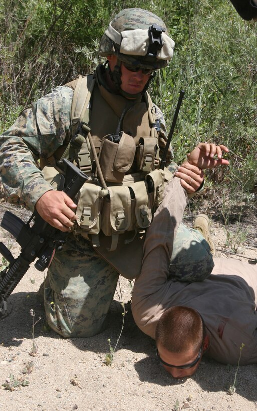 FIRE BASE GLORIA, MARINE CORPS BASE CAMP PENDLETON, Calif. ?Marines with Weapons Company, Battalion Landing Team 1st Battalion, 5th Marine Regiment, 11th Marine Expeditionary Unit participate in a tactical recovery of aircraft and personnel (TRAP) exercise June 14, here. The Marines with the BLT were engaged with a mock CH-46E Sea Knight helicopter accident and the recovery and evacuation of the personnel on board. The training was provided by Special Operations Training Group, I Marine Expeditionary Force.