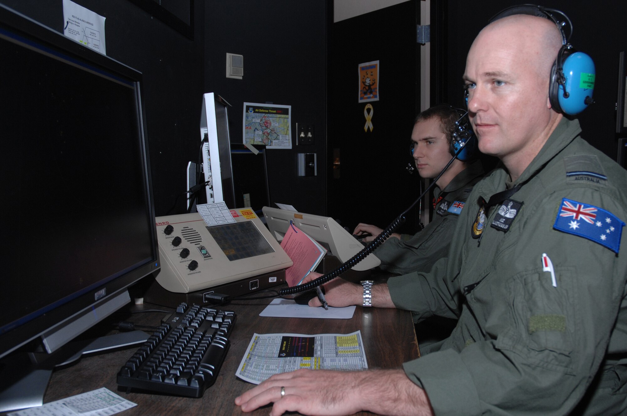 EIELSON AIR FORCE BASE, Alaska -- Flying Officer Murray Ross monitors a radar screen during Red Flag-Alaska 07-02, June 14, 2007. Flying Officer Ross, along with other weapons controllers, monitors the back-up control facility for the exercise and provides support for over 67,000 square miles around Eielson AFB, Alaska.  RF-A is a Pacific Air Forces-directed field training exercise for U.S. forces flown under simulated air combat conditions. Flying Officer Ross is witht the 3rd Control and Reporting Unit fighter controller, Royal Australian air force, Williamtown, Australia, (U.S. Air Force Photo by Staff Sgt Tia. Schroeder) 