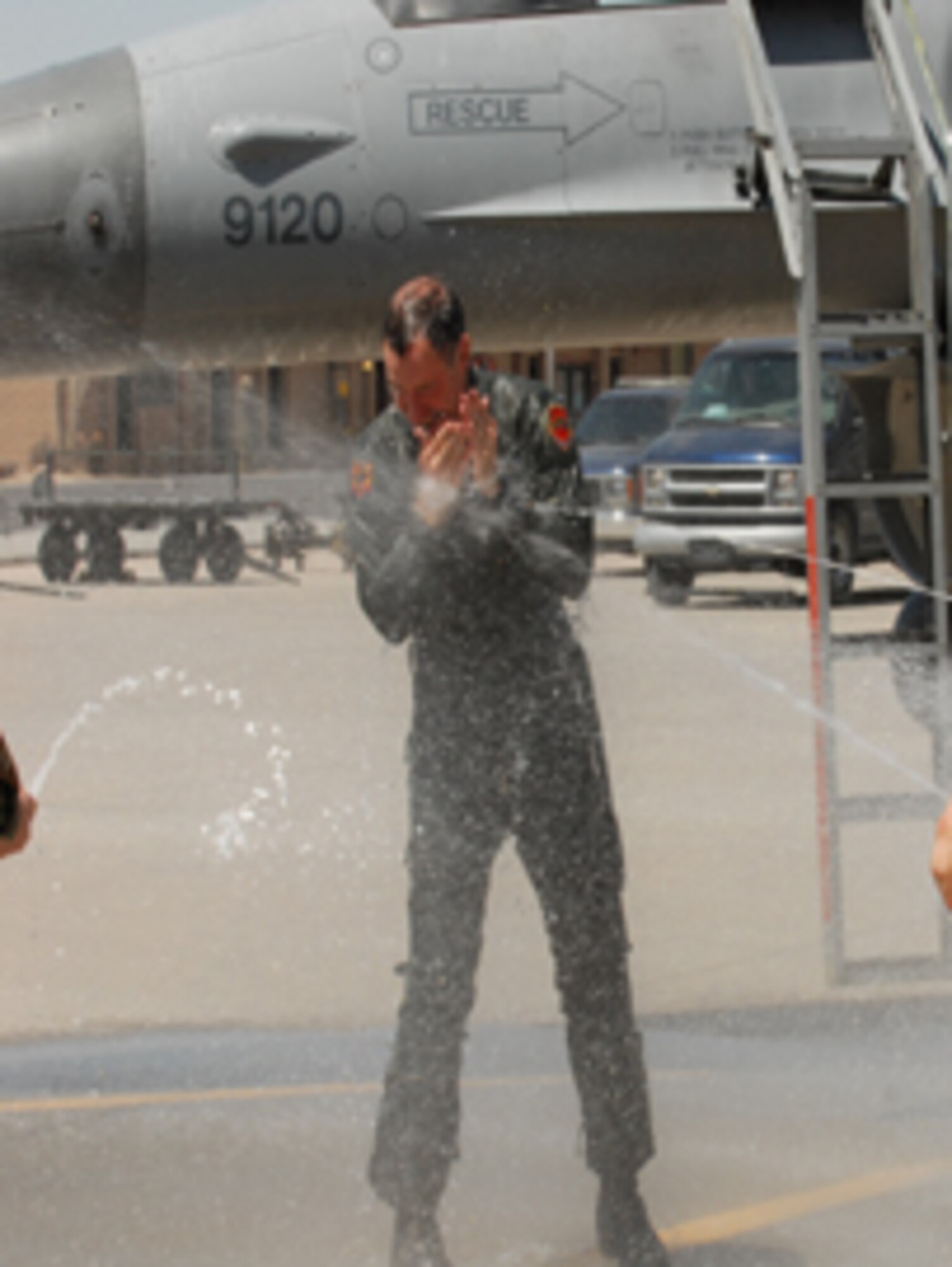 Col. David Orr, 56th Fighter Wing vice commander, gets a traditional soaking following his final flight at Luke June 4.
