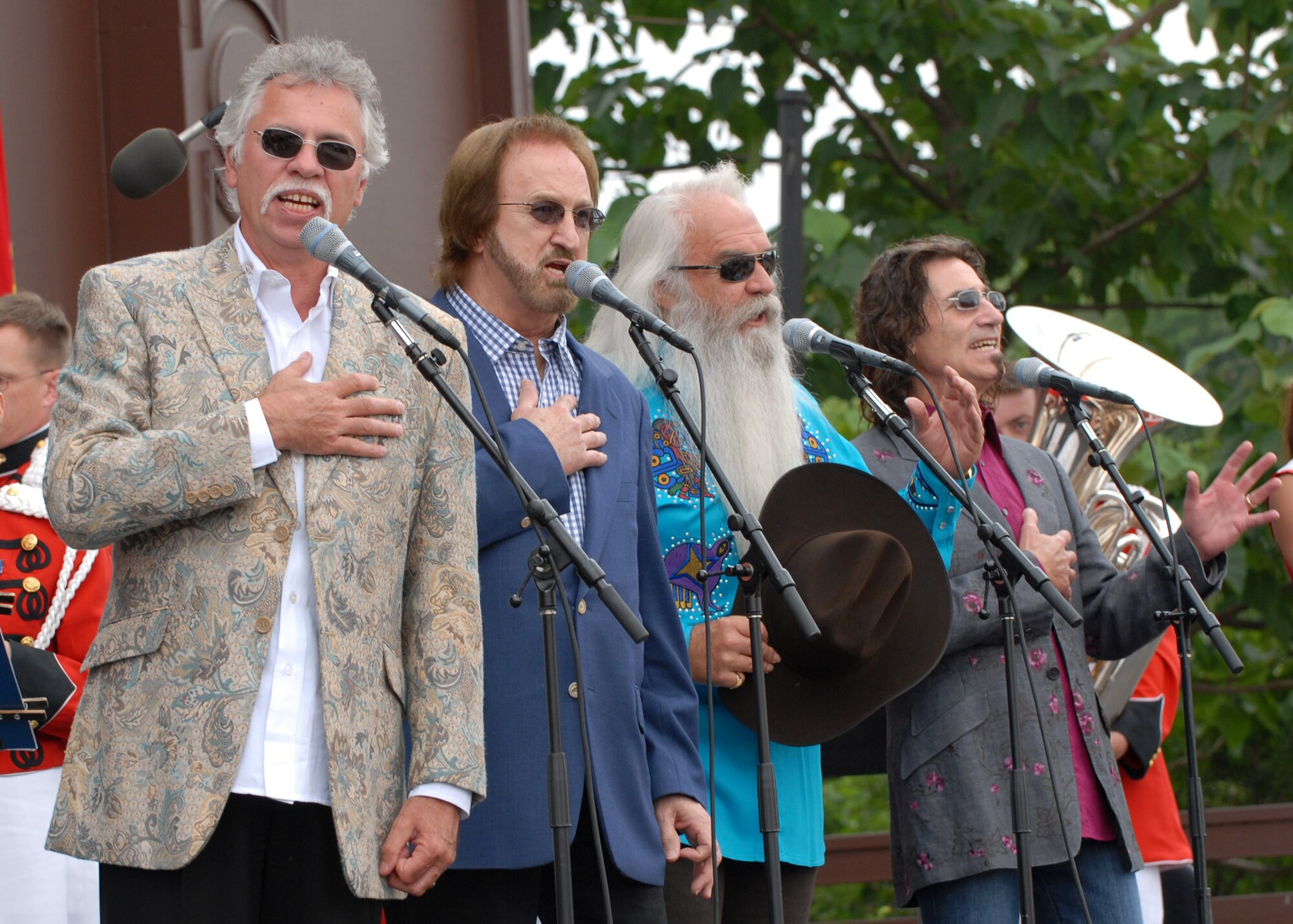 Country music's Oak Ridge Boys lead the singing of the national anthem June 14 during the National Association for Music Education's National Anthem Project grand finale at the Washington Monument on Flag Day. The project is a multiyear effort to re-teach Americans "The Star-Spangled Banner."  (U. S. Navy photo/Petty Officer 2nd Class Molly A. Burgess)