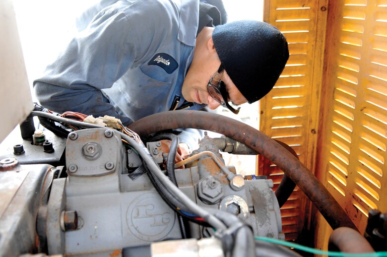 MCCHORD AIR FORCE BASE, Wash. -- Senior Airman Christian Delgado, assigned to the 62nd Logistics Readiness Squadron's multi-purpose vehicle maintenance shop completes a final inspection of the hydraulic system on a snow mobile engine on May 23, 2007. (U.S. Air Force photo/Abner Guzman)