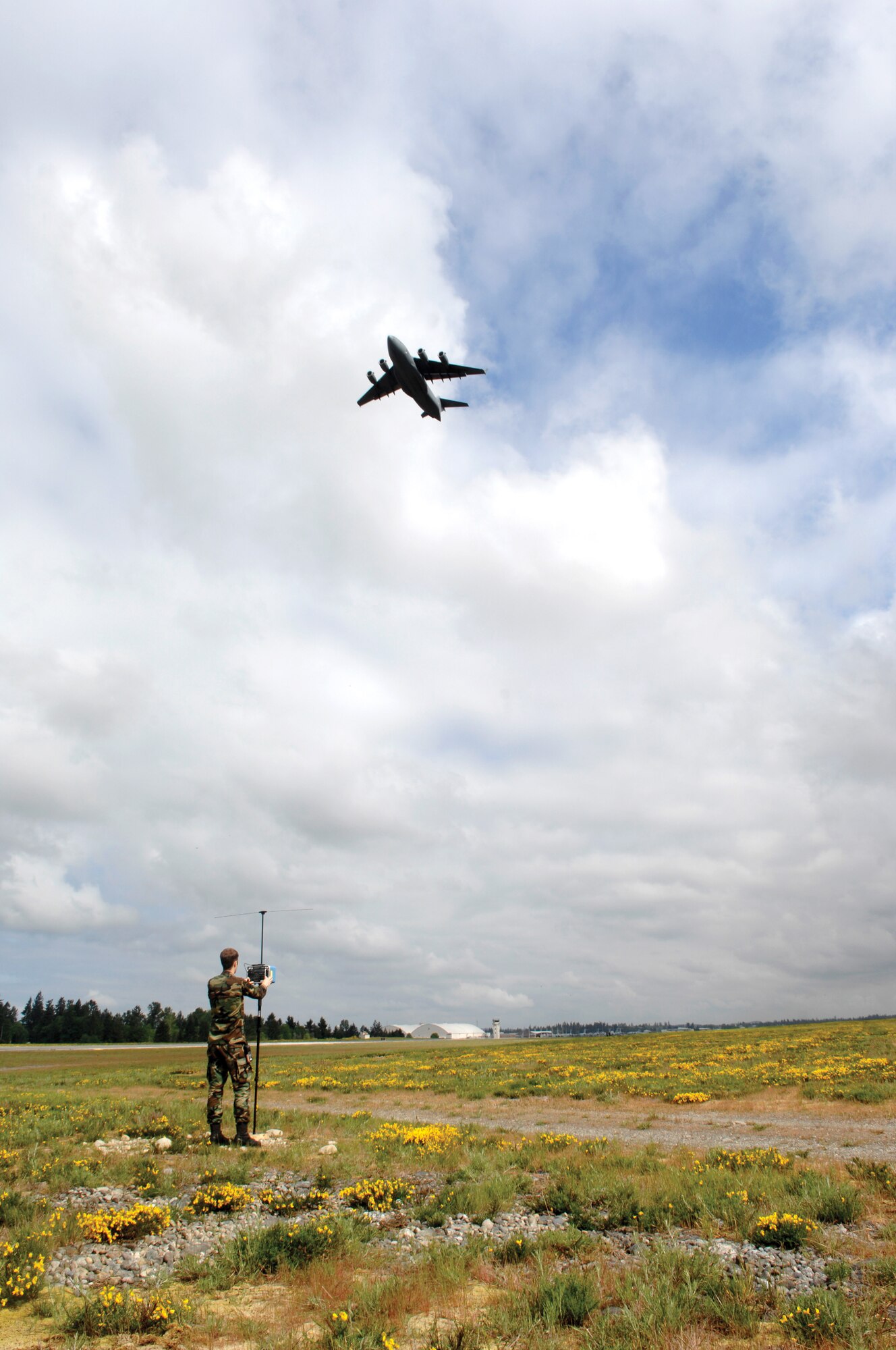 MCCHORD AIR FORCE BASE, Wash. -- Airman First Class Jarrod Wetherhill an airfield systems maintenance technician assigned to the 62nd Communications Squadron, uses a Portable Instrument Landing System Receiver to measure a specific radio frequency on the airfield on May 22, 2007. (U.S. Air Force photo/Abner Guzman)