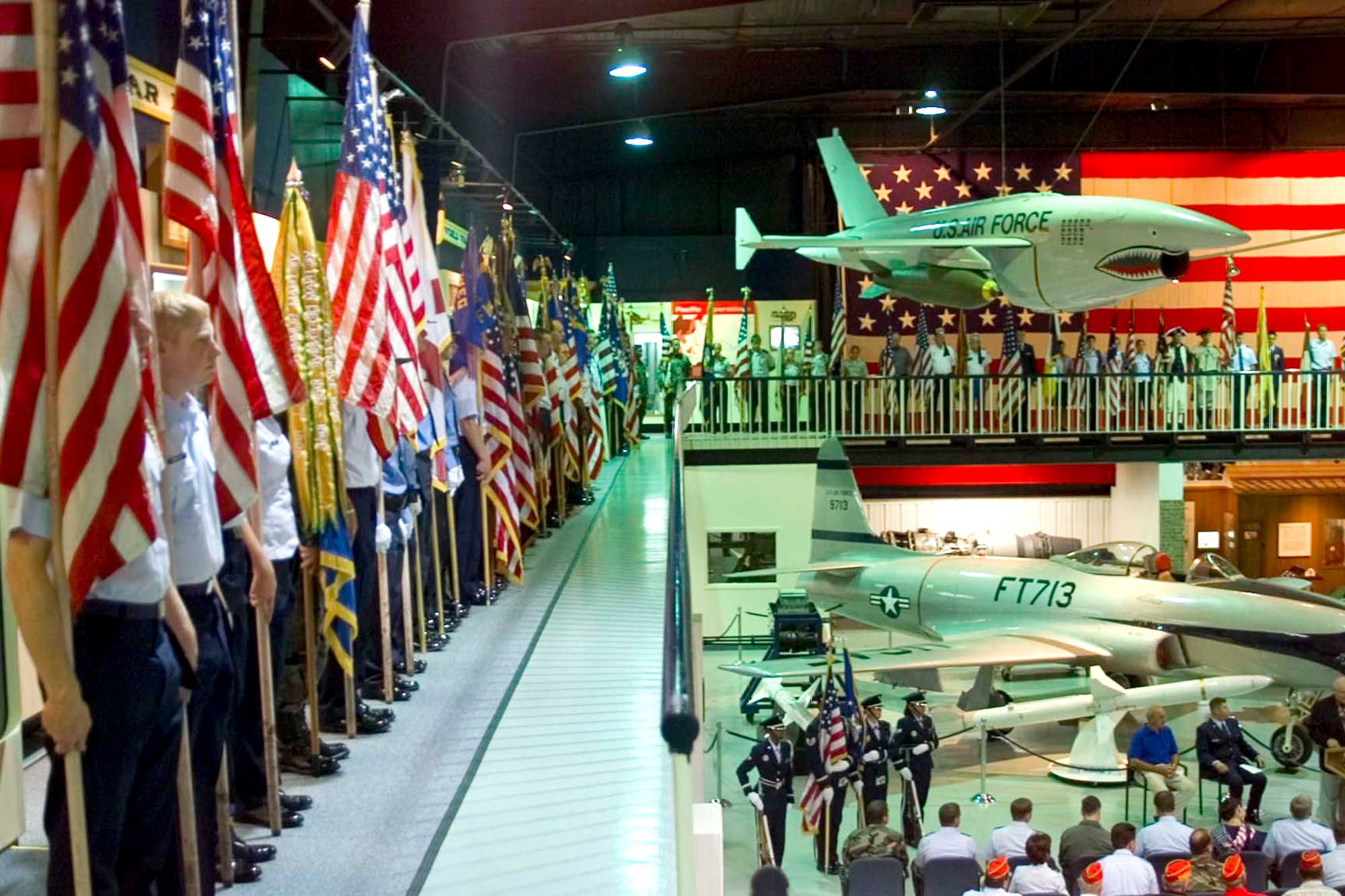 EGLIN AIR FORCE BASE. Fla. -- Flag bearers lined the balcony of the Air Force Armament Museum June 11, 2004, during a Military Order of the World Wars Massing of the Colors ceremony. Retired Lt. Col. Pete Straub, who passed away during the Fall of 2006, organized the first gathering in 1995. Each gathering was held on a day before or after Flag Day for 11 consecutive years. (U.S. Air Force courtesy photo)    