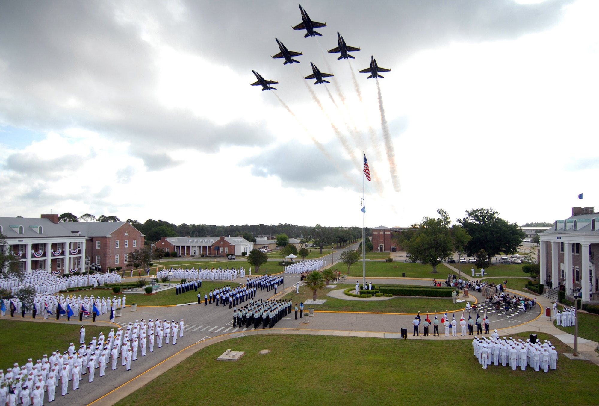 PENSACOLA, Fla.  - The U.S. Navy Blue Angels fly over the Battle of Midway Commemoration Ceremony at the Center for Information Dominance Corry Station, Fla., June 5. Nine veterans of the Battle of Midway joined hundreds of CID Sailors, Soldiers, Airmen, Marines, Coast Guardsmen and guests in the commemoration, held annually to celebrate the decisive victory at Midway.  Corry Station is the host installation to the 313th Training Squadron, a geographically separated unit of Goodfellow Air Force Base. (U.S. Navy photo by Gary Nichols)