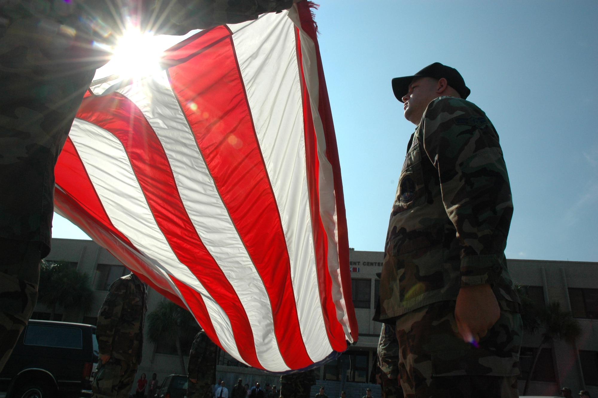 EGLIN AIR FORCE BASE, Fla. -- Airmen from the 46th Test Wing prepares to fold the American Flag during base retreat at the Air Armament Center headquarters building June 14. The rest of the Airmen in the wing were in formation near the flag pole during the ceremony. June 14 is historically Flag Day, a day that Americans are asked to remember what the flag represents and to pay their respect to it. (U.S. Air Force photo by Staff Sgt. Mike Meares)