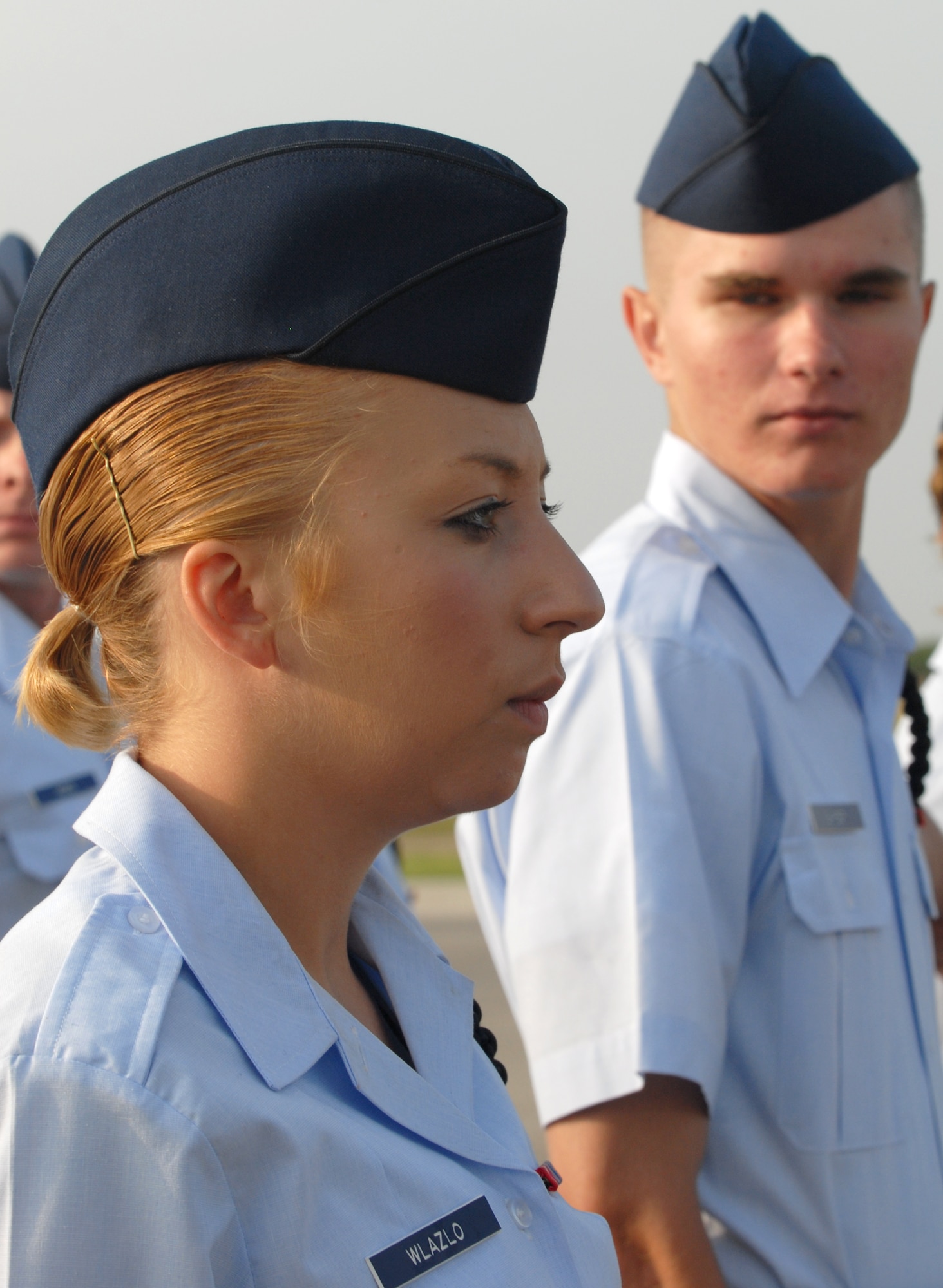 Airman 1st Class Shannon Wlazlo of the 315th Training Squadron stands at attention as her drill team performs the dress-right-dress maneuver during the open ranks portion of the 17th Training Group drill competition June 9. (U.S. Air Force photo by Tech. Sgt. Randy Mallard).