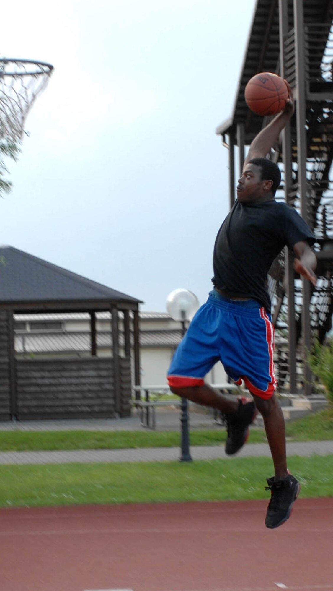 SPANGDAHLEM AIR BASE, GERMANY -- Airman 1st Class Kristopher Davis, 606th Air Control Squadron, shoots some hoops in his free time June 7. Staying active outside of organized physical training keeps Airmen "fit to fight." (US Air Force photo/Airman 1st Class Stephanie Clark)