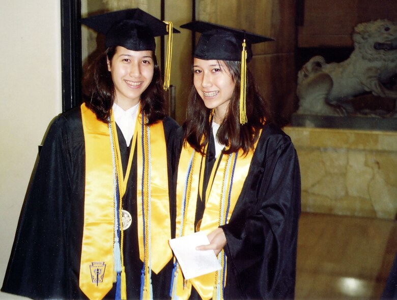 Kristin and Lorianne Arden at their graduation from Kadena High School last week. The twin sisters were the valedictorian and salutatorian for the class out of a total of 182 graduates.
(Air Force/courtesy photo)