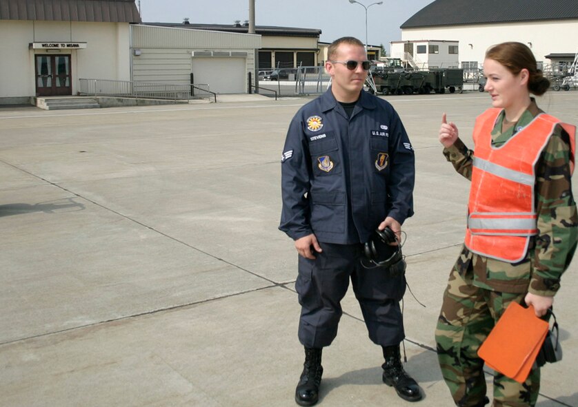 Visit provides meaningful experience for dozens of cadets. Senior Airman Tyler Stevens, 35th Maintenance Squadron transient alert journeyman, gives instructions to Cadet 4th Class Kimberly Perkins during a recent visit to Misawa Air Base, Japan. The visit gave twenty cadets a chance to experience life around an actual Air Force base as well as have the experience of following some Airmen while they were on the job. (Air Force photo by Staff Sgt. Vann Miller)