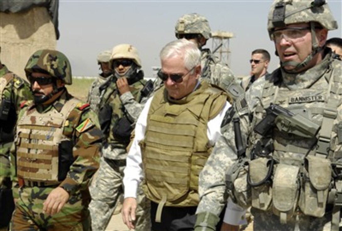 Secretary of Defense Robert M. Gates tours a Joint Security Station with U.S. Army Col. Jeffrey Bannister and Iraqi Staff Gen. Riyadh Talal Tawfiq in Baghdad, Iraq, June 16, 2007. 