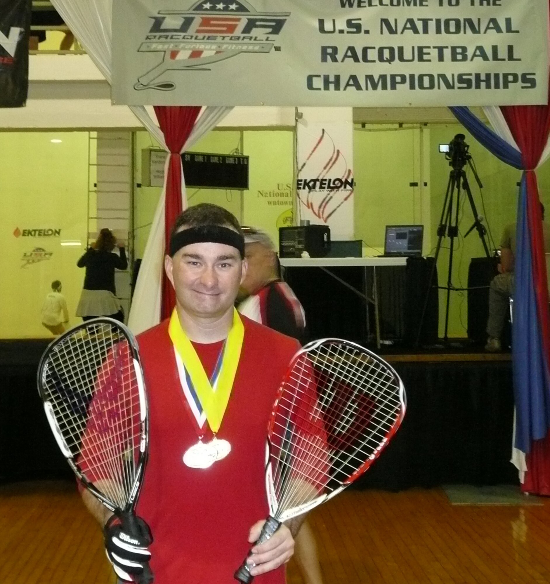 Tech. Sgt. Shaun Stone, 961st Airborne Air Control Squadron E-3 airborne communications systems operator, poses with his medals at the U.S. National Singles Racquetball Championships held in Houston, Texas, recently. Sergeant Stone earned the silver medal in the “B” skill division and the gold in the over 35 “A” skill division.