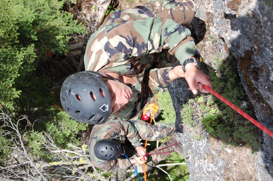 Staff Sgt. Michael Garcia (foreground), and Staff Sgt. Matthew Zimmer, competitors in the 2007 SERE Challenge, climb a 70-foot rock face June 11 in Colville National Forest, Washington.  Sergeants Garcia and Zimmer, SERE Specialists assigned as water survival instructors at Fairchild AFB, Wash., were the top team among 15 who competed.  (U.S. Air Force photo by Staff Sgt. Matthew Rosine)

