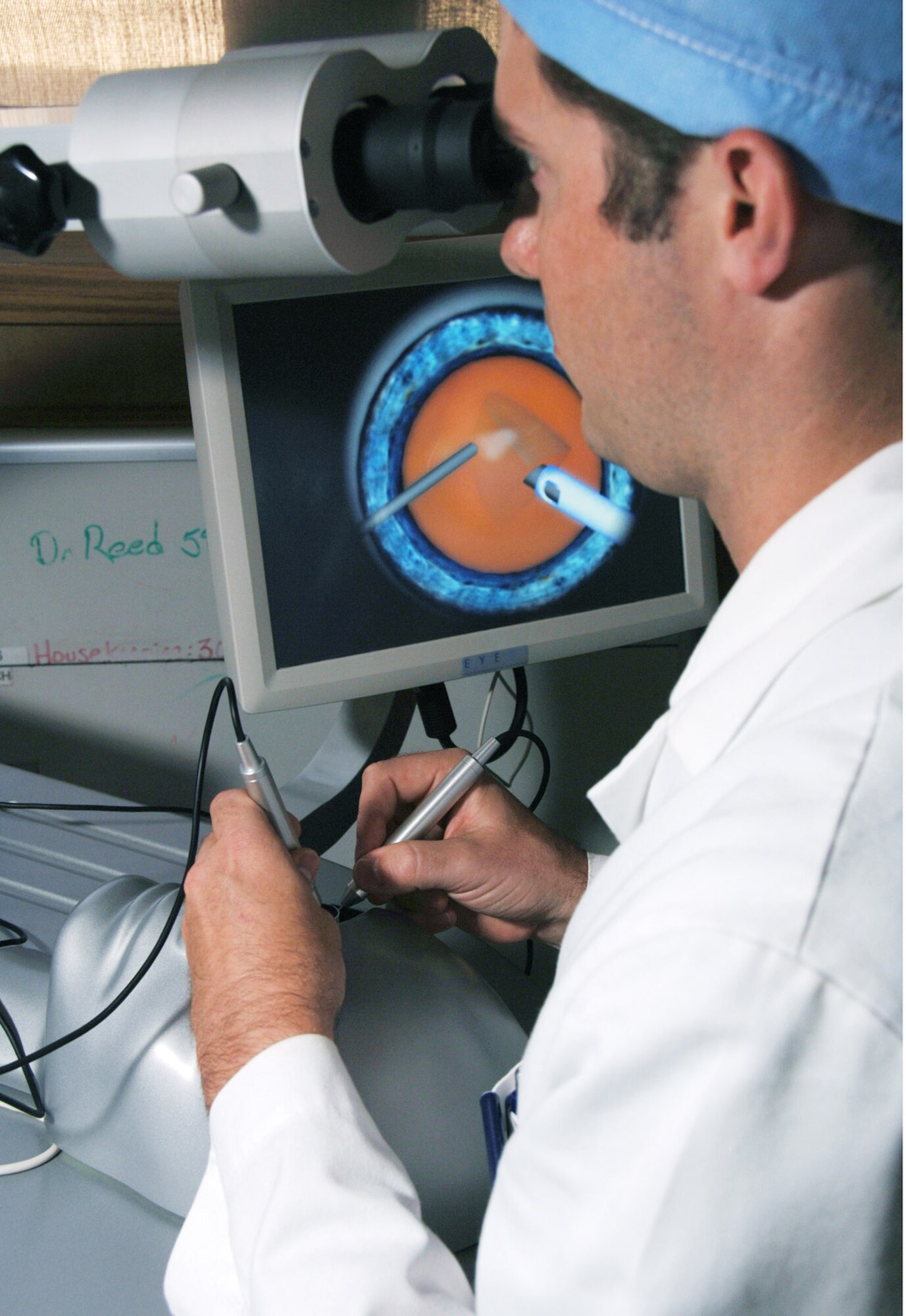 First-year ophthalmology resident Capt. (Dr.) Clifford Brooks uses state-of-the-art simulation training to practice and improve his cataract surgery techniques. He currently is participating in the ophthalmology residency program at Wilford Hall Medical Center, Lackland Air Force Base, Texas.  (U.S. Air Force photo/Master Sgt. Kimberly A. Yearyean-Siers) 