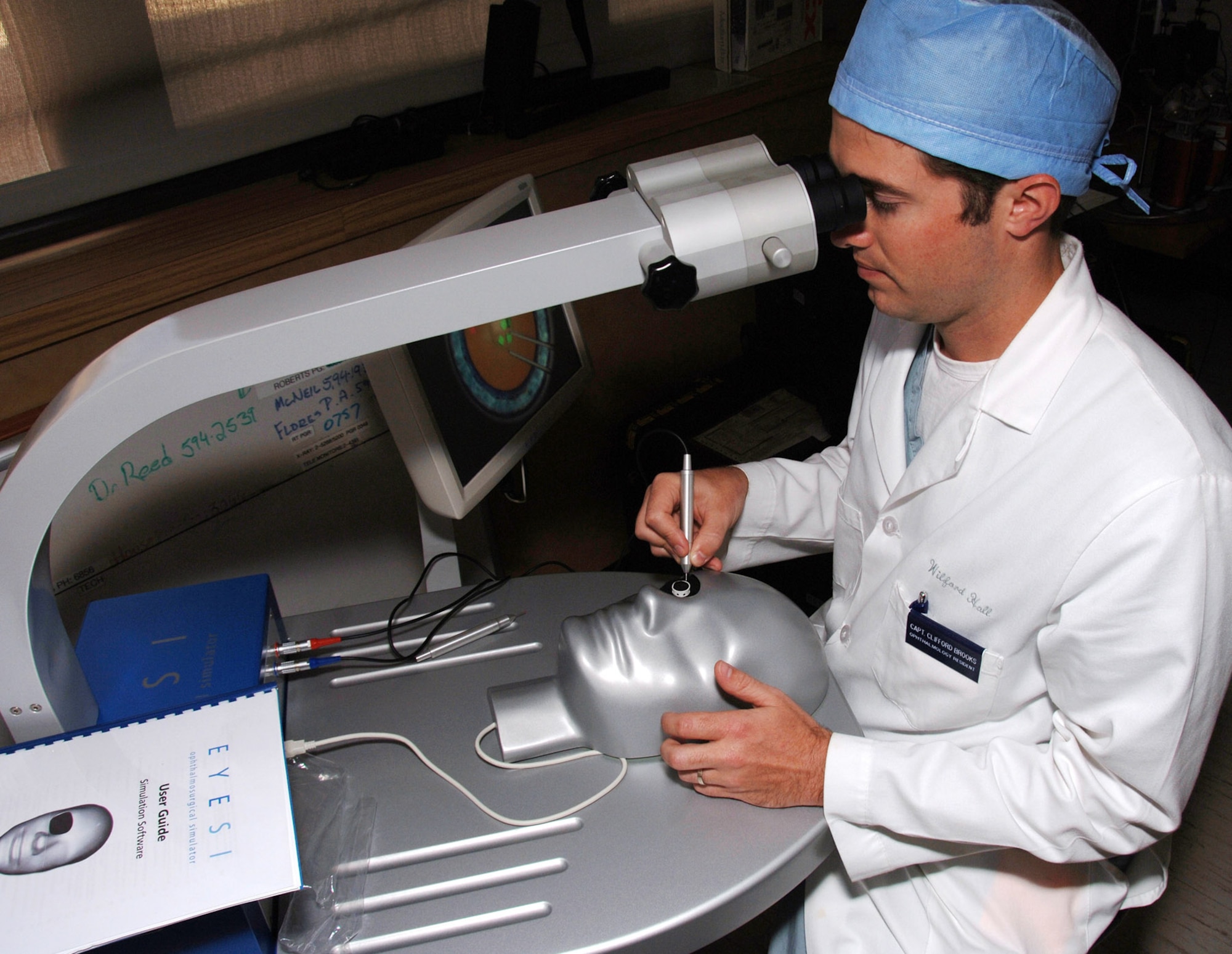 First-year ophthalmology resident Capt. (Dr.) Clifford Brooks uses state-of-the-art simulation training to practice and improve his cataract surgery techniques. He currently is participating in the ophthalmology residency program at Wilford Hall Medical Center, Lackland Air Force Base, Texas.  (U.S. Air Force photo/Master Sgt. Kimberly A. Yearyean-Siers) 