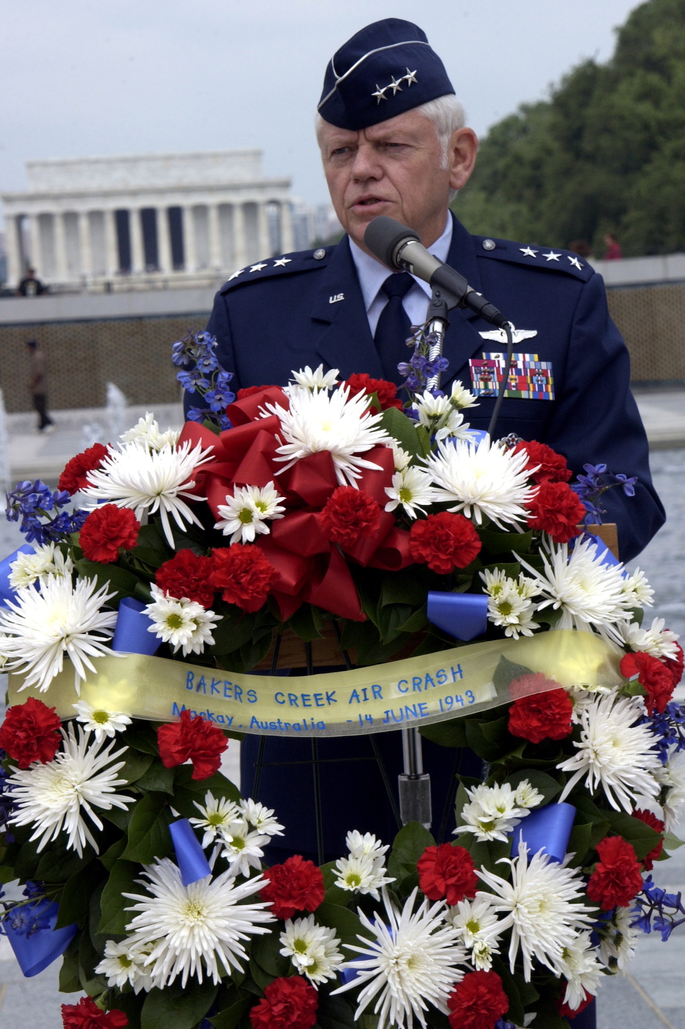 At a ceremony at the World War II Memorial June 14 in Washington D.C., Lt. Gen. Arthur Lichte, Air Force assistant vice chief of staff, recounted the Bakers Creek air crash in Australia in June 1943 in which 40 American servicemembers lost their lives.  The ceremony here commemorated the 64th anniversary of the crash.  (U.S. Air Force photo/Staff Sgt. J.G. Buzanowski) 