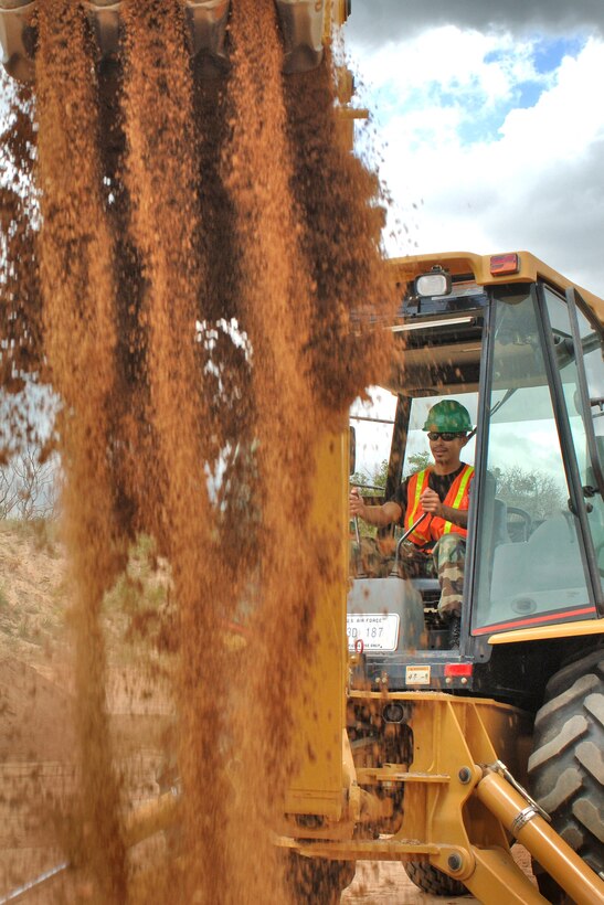 Cadet 1st Class Qais Al Jobour operates a backhoe during the Field Engineering and Readiness Laboratory course at the Academy.  The course exposes cadets to several aspects of civil engineering, including heavy equipment operation, steel bridge construction, designing and pouring concrete beams and paving portions of a road. (U.S. Air Force photo/Joel Strayer)
