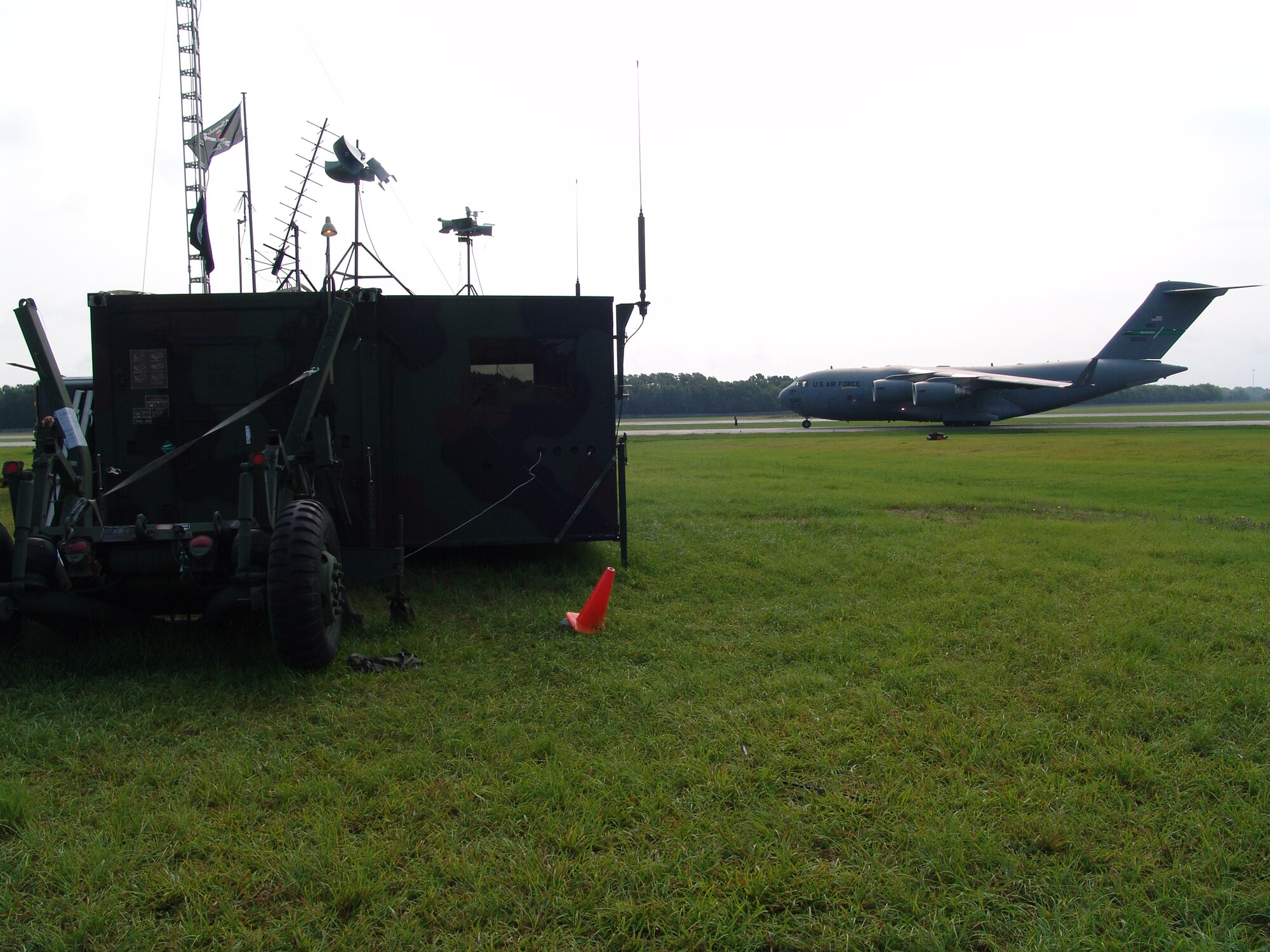 C-17 Globemaster aircraft dubbed 'Panda 99' taxis past the Contingency Response Element trailer at Augusta Regional Airport - Bush Field, Ga., during Golden Medic 2007.