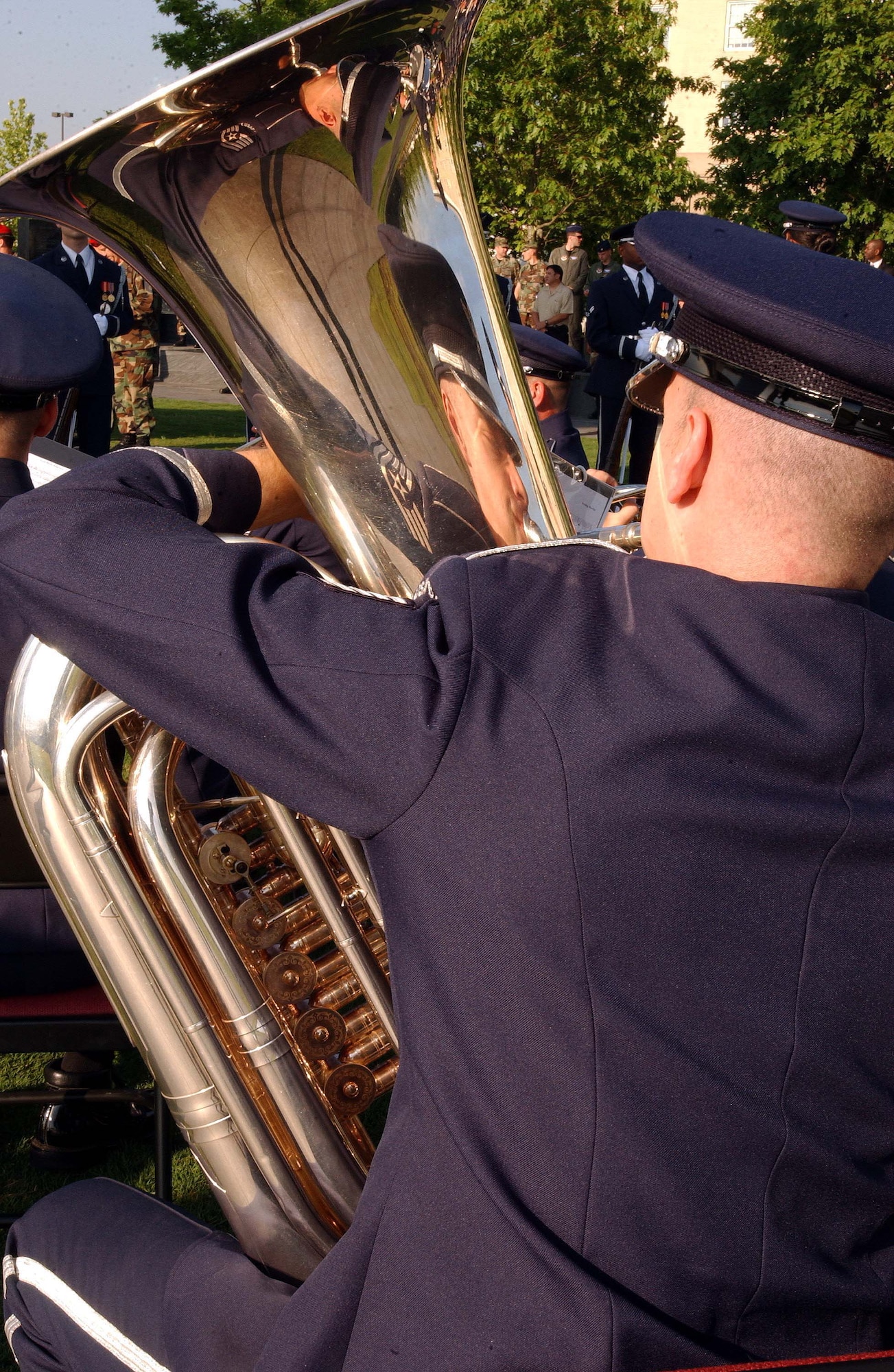 ARLINGTON, Va. -- A tuba player with the Air Force Band plays "God Bless America" during the Air Force Combat Action Medal ceremony June 12. Air Force Chief of Staff Gen. T. Michael Moseley presented six Airmen with the medal at the Air Force Memorial. The Airmen were the first in history to receive the new medal. Among the recipients was Master Sgt. Charlie Peterson, a Reservist with the 927th Logistics Readiness Squadron at Selfridge Air National Guard Base, Mich. (U.S. Air Force photo/Staff Sgt. Amaani Lyle)