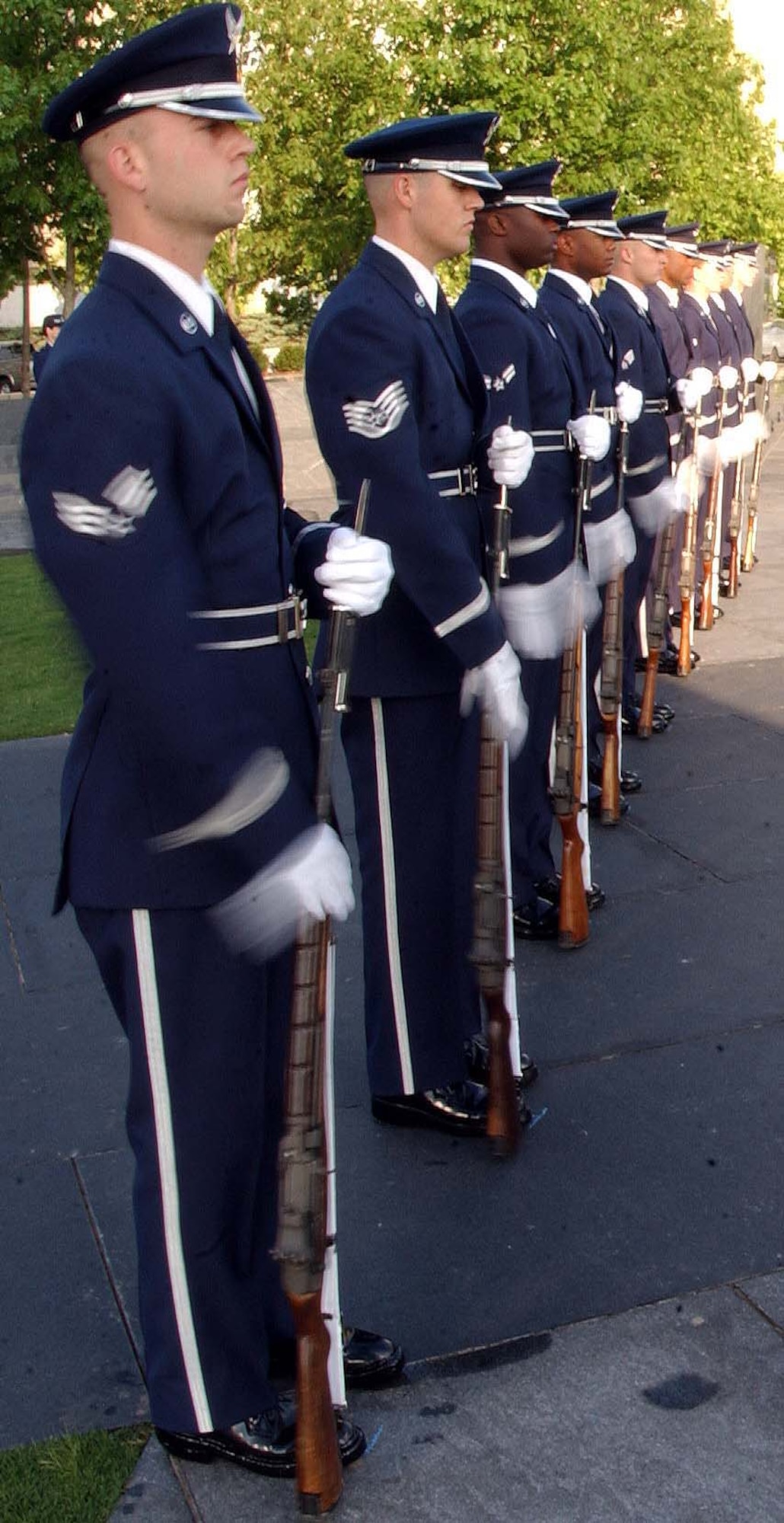 ARLINGTON, Va. -- Members of the U.S. Air Force Honor Guard from Bolling Air Force Base, D.C., synchronize their rifles during the Air Force Combat Action Medal ceremony June 12. General Moseley presented six Airmen with the medal at the Air Force Memorial. The Airmen were the first in history to receive the new medal, created to recognize Air Force members who were engaged in air or ground combat "outside the wire." Among the recipients was Master Sgt. Charlie Peterson, a Reservist with the 927th Logistics Readiness Squadron at Selfridge Air National Guard Base, Mich. Tom Galpin, grandson of World War I veteran Brig. Gen. William "Billy" Mitchell, also attended the ceremony. (U.S. Air Force photo/Staff Sgt. Amaani Lyle)