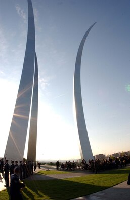 ARLINGTON, Va. -- The sun rises above the Air Force Memorial during the Air Force Combat Action Medal ceremony June 12. Air Force Chief of Staff Gen. T. Michael Moseley presented six Airmen with the medal, created to recognize Air Force members who were engaged in air or ground combat "outside the wire."  The Airmen were the first in history to receive the new medal. Among the recipients was Master Sgt. Charlie Peterson, a Reservist with the 927th Logistics Readiness Squadron at Selfridge Air National Guard Base, Mich. Tom Galpin, grandson of World War I veteran Brig. Gen. William "Billy" Mitchell, also attended the ceremony. (U.S. Air Force photo/Staff Sgt. Amaani Lyle)