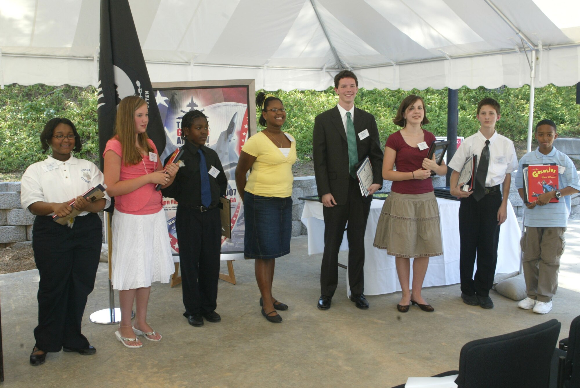 Contest winners from left to right: Kaitlyn Martin, Allison Higgins, Deon Geiger, Persephanie May, Aaron Riker, Jalen Thomas, Evan Woolard and Jason Gerson. (U.S. Air Force photo/Don Peek) 