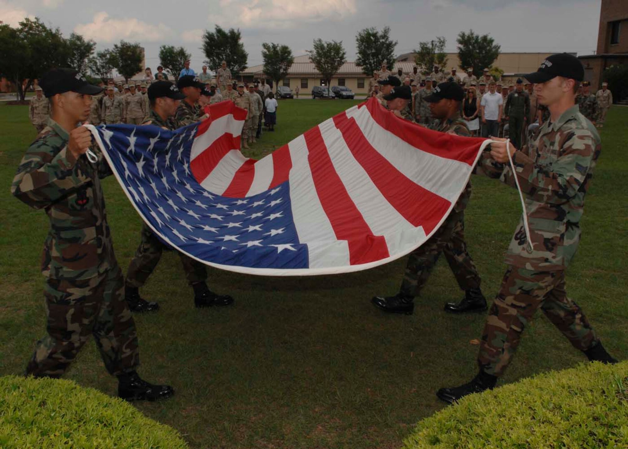 SHAW AIR FORCE BASE, S.C.--Members of the Shaw Air Force Base Honor Guard fold an unserviceable flag which was retired as part of the Flag Day ceremony June 14. In accordance with the U.S. Flag Code 36S 176, “the flag, when it is in such condition that it is no longer a fitting emblem of display, should be destroyed in a dignified way.