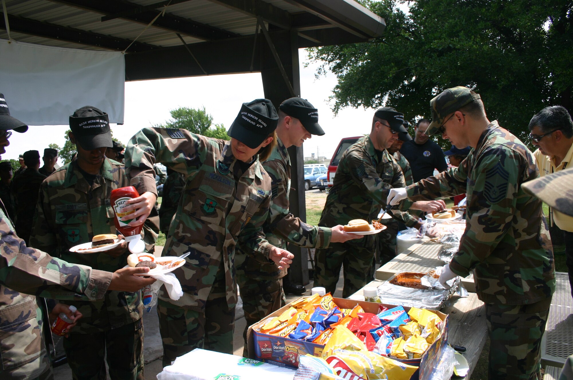 Team Sheppard members eat at the honor guard appreciation luncheon held by the Sheppard Chiefs Group June 14. (U.S. Air Force photo/Staff Sgt. Tonnette Thompson)