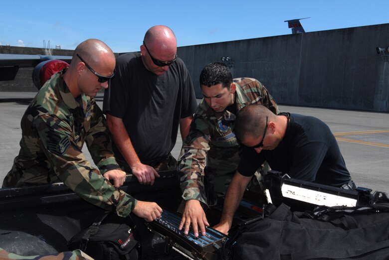 Staff Sgt. Aaron Merrell (left), Tech. Sgt. Robert Spears (left center), Senior Airman Joshua Arredondo (right center), and Tech. Sgt. Bryn Lochman, all from the 718th Air Maintenance Squadron, Kadena Air Base, Japan, inventory their consolidated tool kit after working on a KC-135 aircraft in preparation for the Air Mobility Rodeo July 22-28 at McChord Air Force Base, Wash. Several 18th Wing units have begun practicing for the annual competition that pits teams from around the world. 
(U.S. Air Force/Airman 1st Class Kasey Zickmund)