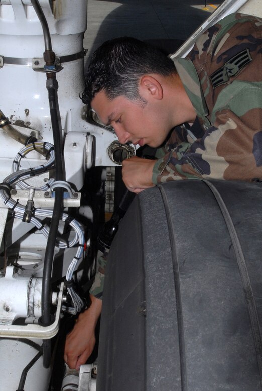 Senior Airman Joshua Arredondo, 718th Air Maintenance Squadron, Kadena Air Base, Japan, inspects the centering cylinder on a KC-135 aircraft in preparation for the Air Mobility Rodeo July 22-28 at McChord Air Force Base, Wash. Several 18th Wing units have begun practicing for the annual competition that pits teams from around the world. 
(U.S. Air Force/Airman 1st Class Kasey Zickmund)