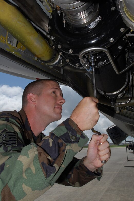 Tech. Sgt. Bryn Lochman, 718th Air Maintenance Squadron, changes the oil on a KC-135 aircraft in preparation for the Air Mobility Rodeo July 22-28 at McChord Air Force Base, Wash. Several wing units have begun practicing for the annual competition that pits teams from around the world. 
(U.S. Air Force/Airman 1st Class Kasey Zickmund)
