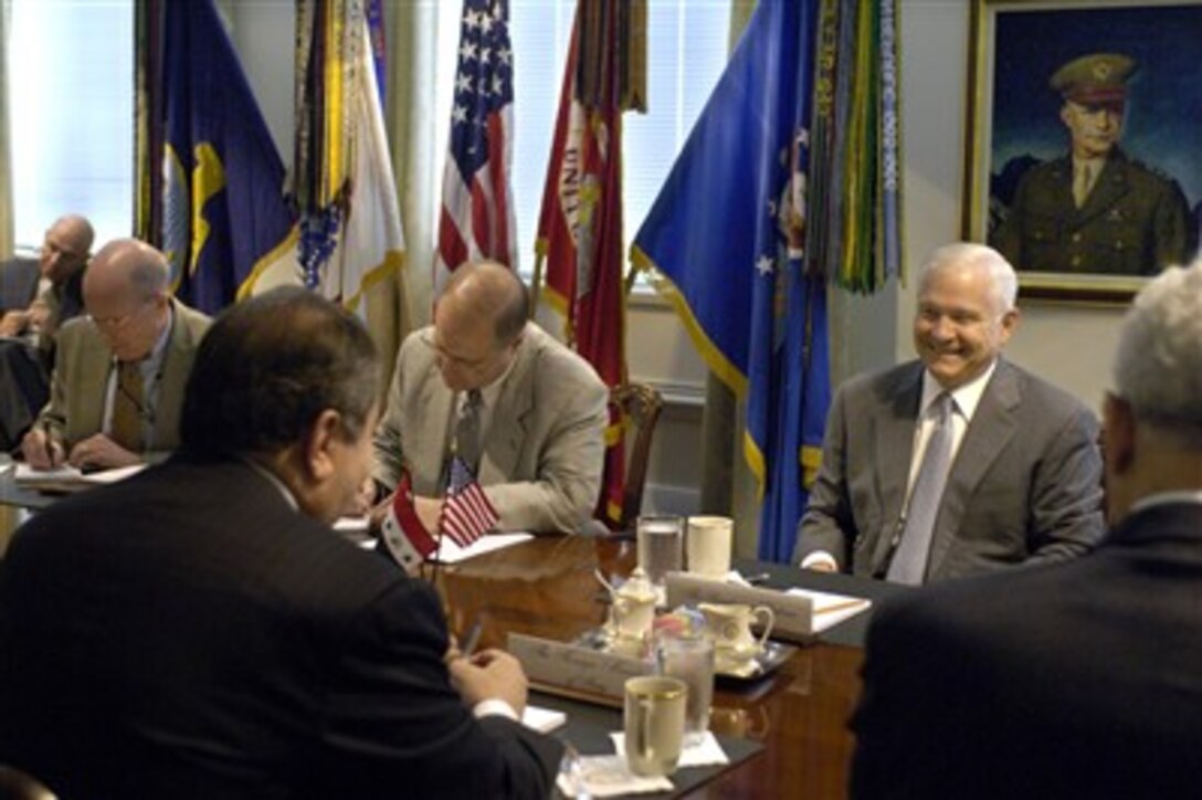Secretary of Defense Robert M. Gates smiles across the table at visiting Iraqi Minister of Foreign Affairs Hoshyar Zebari as Gates shares details of an interesting experience from his recent trip to Iraq. Zebari and Gates were to discuss various bilateral security issues during this June 18, 2007, Pentagon meeting.