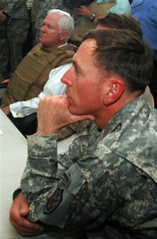 Commander of Multi-National Force - Iraq Gen. David H. Petraeus (right), U.S. Army, and Secretary of Defense Robert M. Gates listen to a briefing by Iraqi commanders during a visit by Gates to Baghdad, Iraq, on June 16, 2007.  