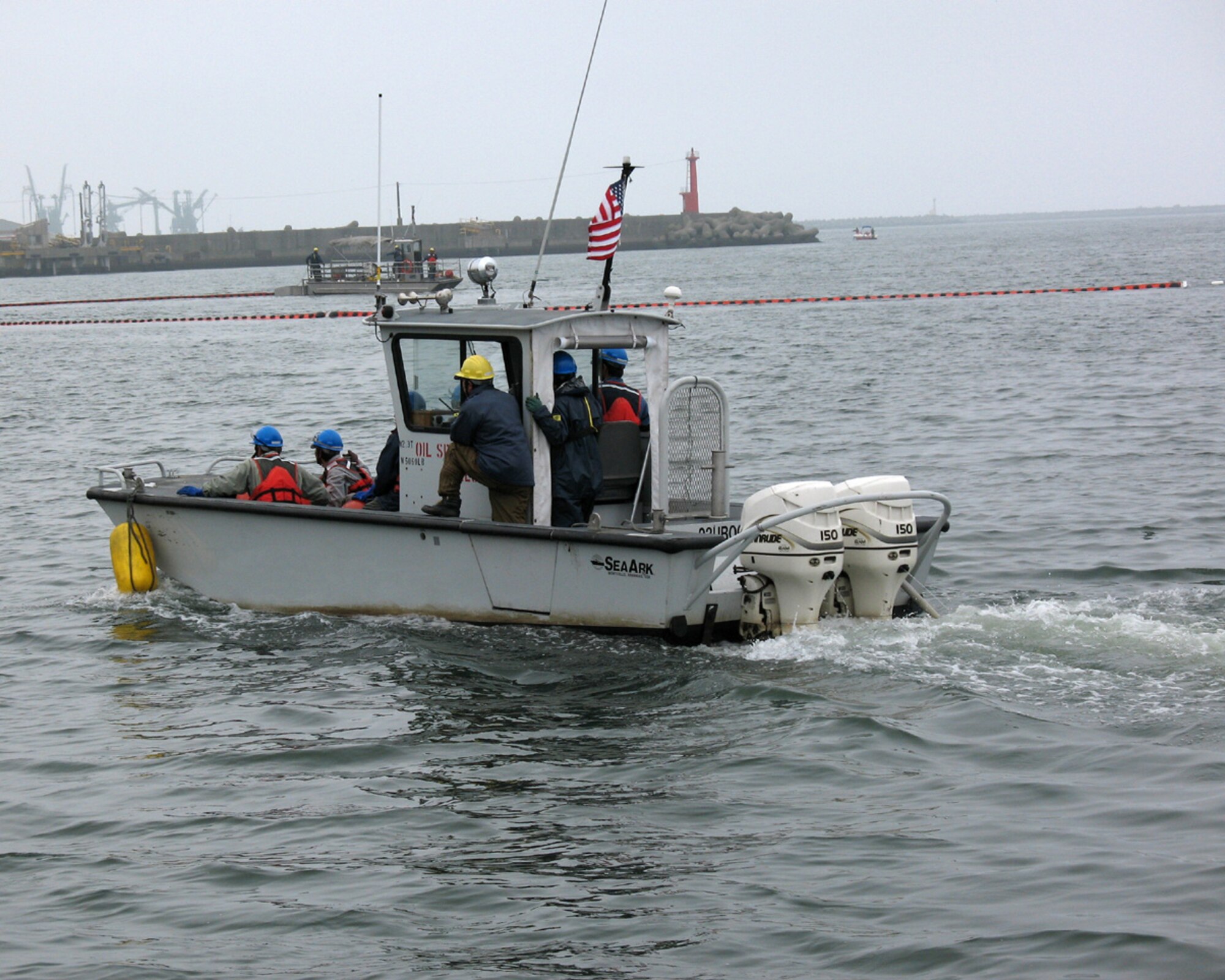 MISAWA AIR BASE, Japan -- Misawa Airmen and Sailors and recently trained together to respond to a spill at a Navy fuel facility at Hachinohe port. The fuel facility holds this annual exercise to keep responders refreshed on oil cleanup techniques.   (U.S. Navy photo by MCSN Shane Arrington)