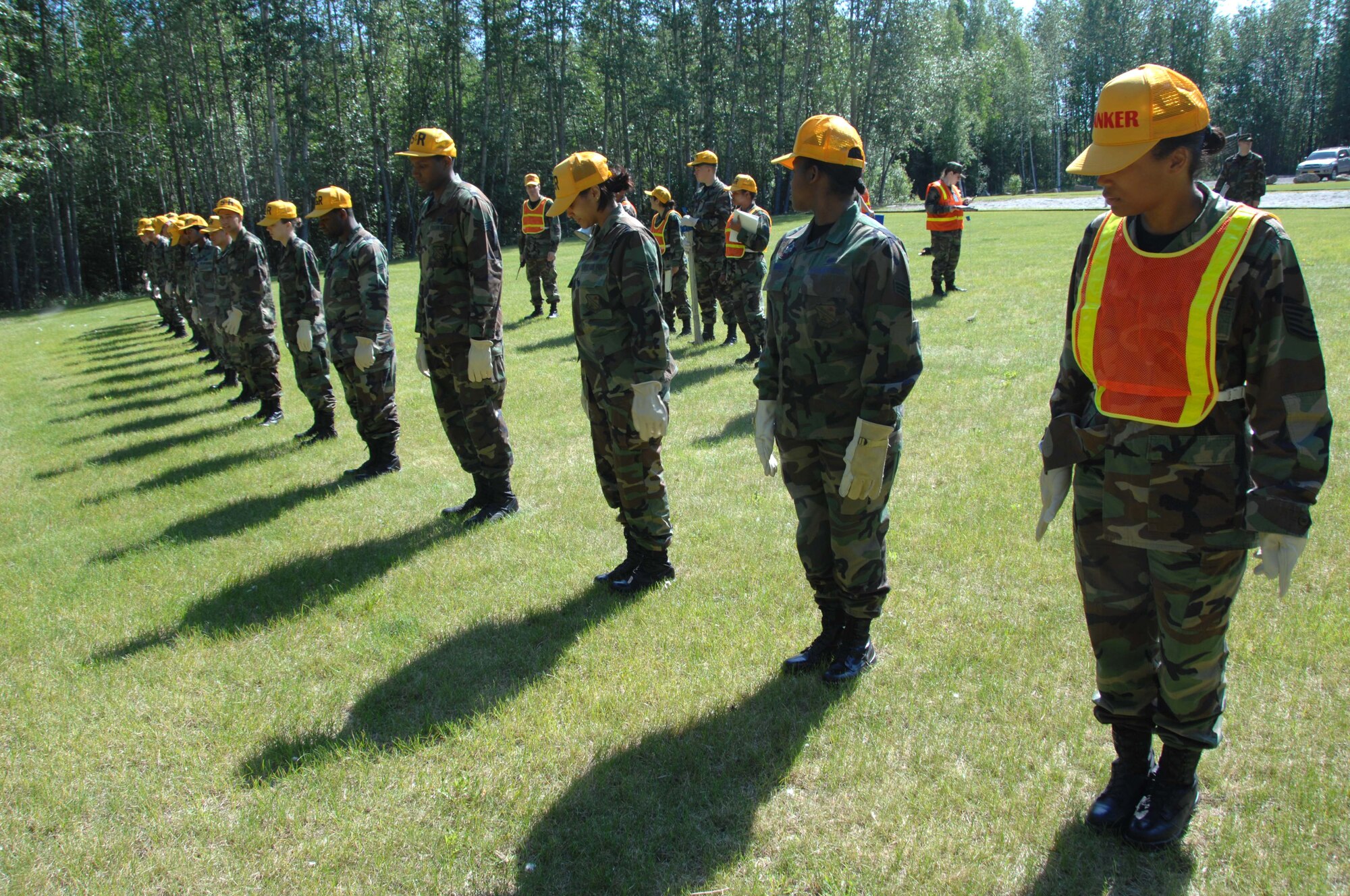 EIELSON AIR FORCE BASE, Alaska -- Members of the 354th Force Support Squadron emergency response search and recovery team conduct a sweep of a simulated aircraft mishap during an emergency management exercise June 19, 2007 here. The exercise was designed to provide a realistic aircraft crash training scenario for emergency teams. (U.S. Air Force photo by Staff Sgt. Tia Schroeder)