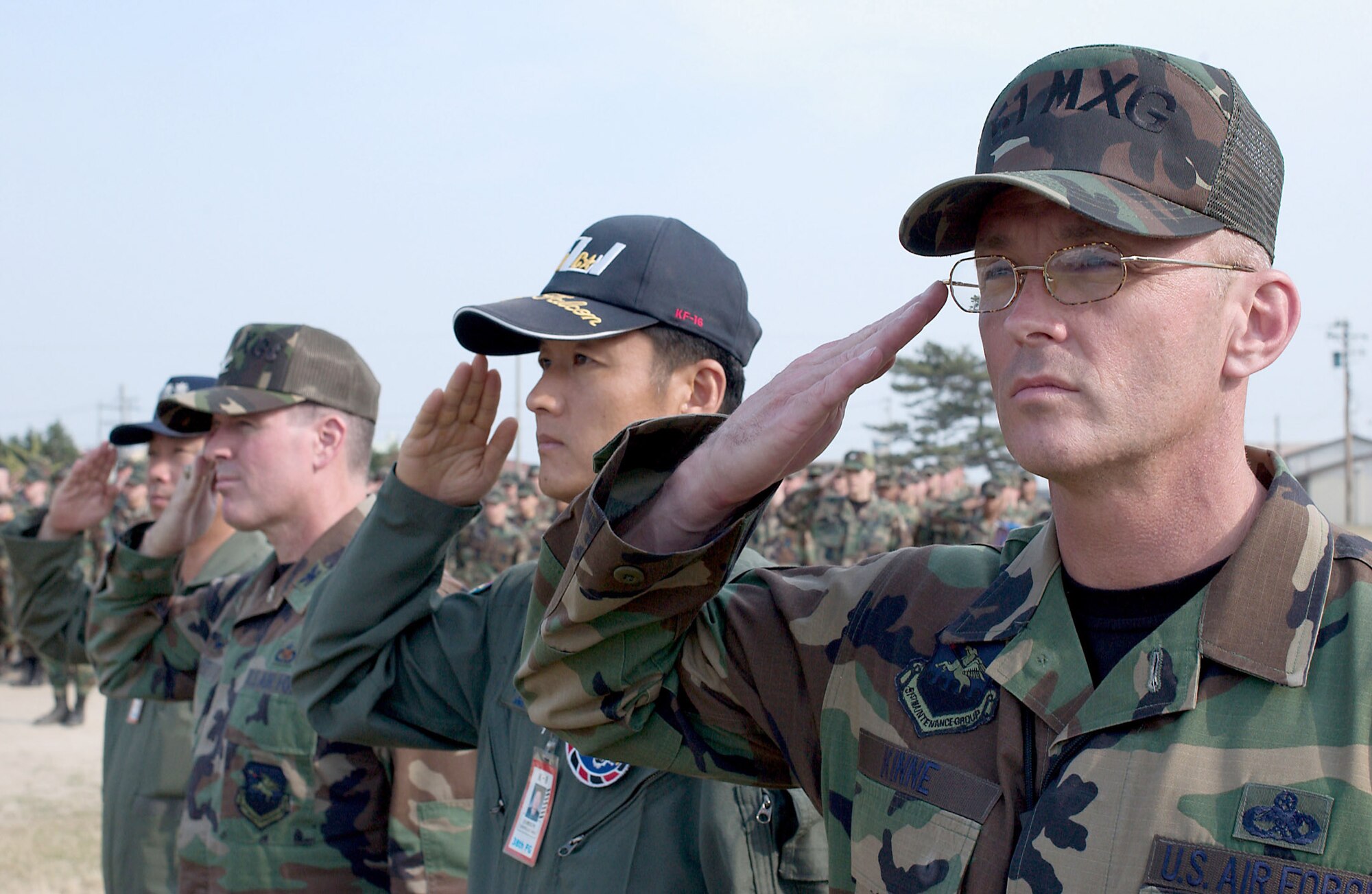 Airmen from the 51st Maintenance Group at Osan Air Base, South Korea, and members of the Republic of Korea Air Force take part in a retreat ceremony June 19 at Kunsan Air Base, South Korea, that was part of the 8th Fighter Wing's commemoration event to honor the memory of Brig. Gen. Robin Olds, who recently passed away.  General Olds was a triple ace fighter pilot in World War II and Vietnam and was a former commander of the then 8th Tactical Fighter Wing at Kunsan.  (U.S. Air Force Photo/Senior Airman Barry Loo)
