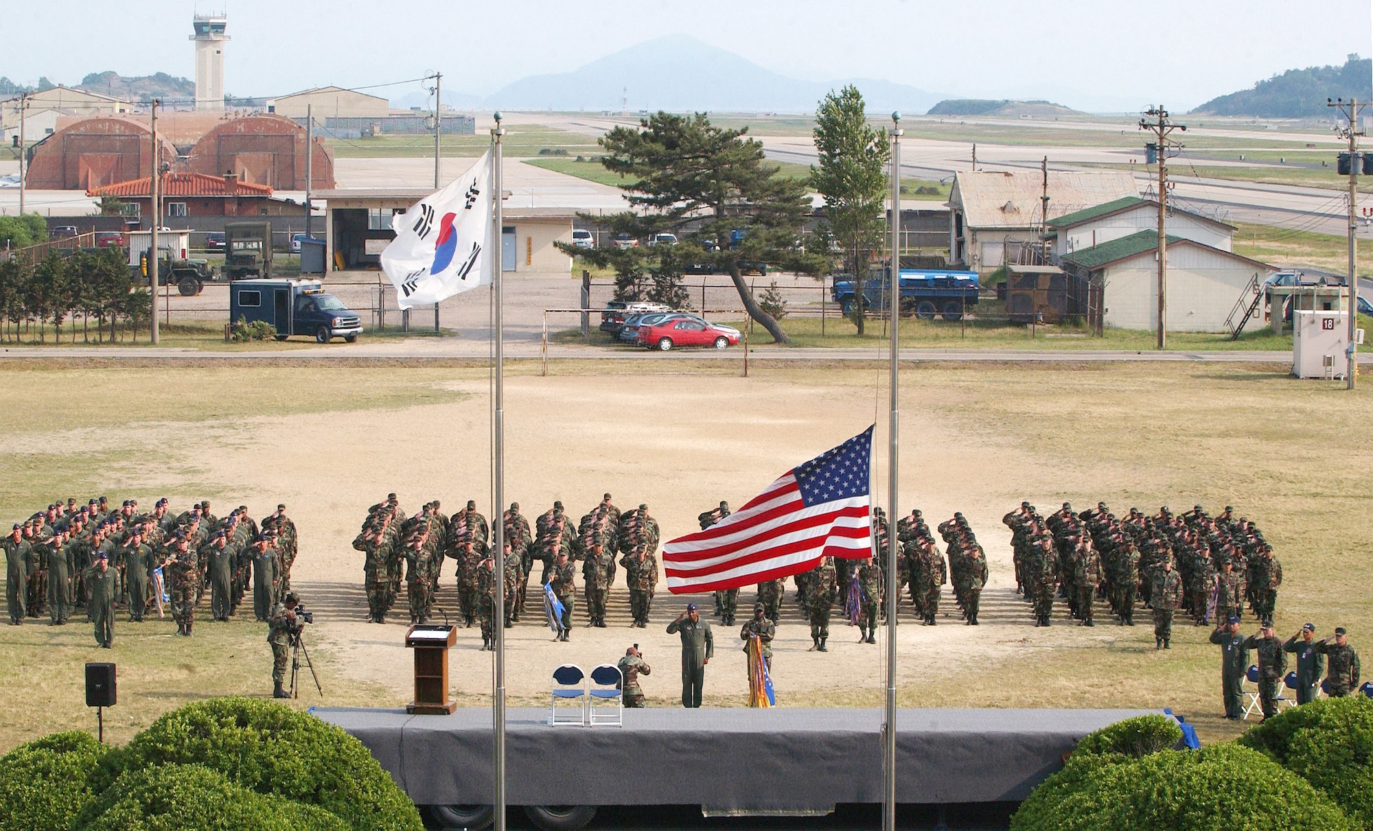 Airmen from the 8th Fighter Wing at Kunsan Air Base, South Korea, salute during a retreat ceremony that was part of the wing's commemoration event June 19 to honor the memory of Brig. Gen. Robin Olds, who passed away recently.  General Olds was a triple ace fighter pilot in World War II and Vietnam and a former commander of the then 8th Tactical Fighter Wing at Kunsan.  (U.S. Air Force Photo/Senior Airman Steven R. Doty) 