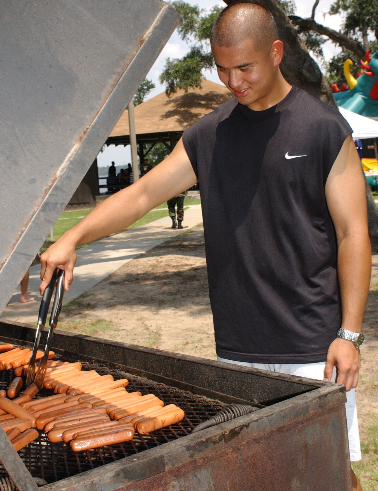 Airman Wei Lin, 81st Aerospace Medicine Squadron, mans the grill.  (U. S. Air Force photo by Kemberly Groue)
