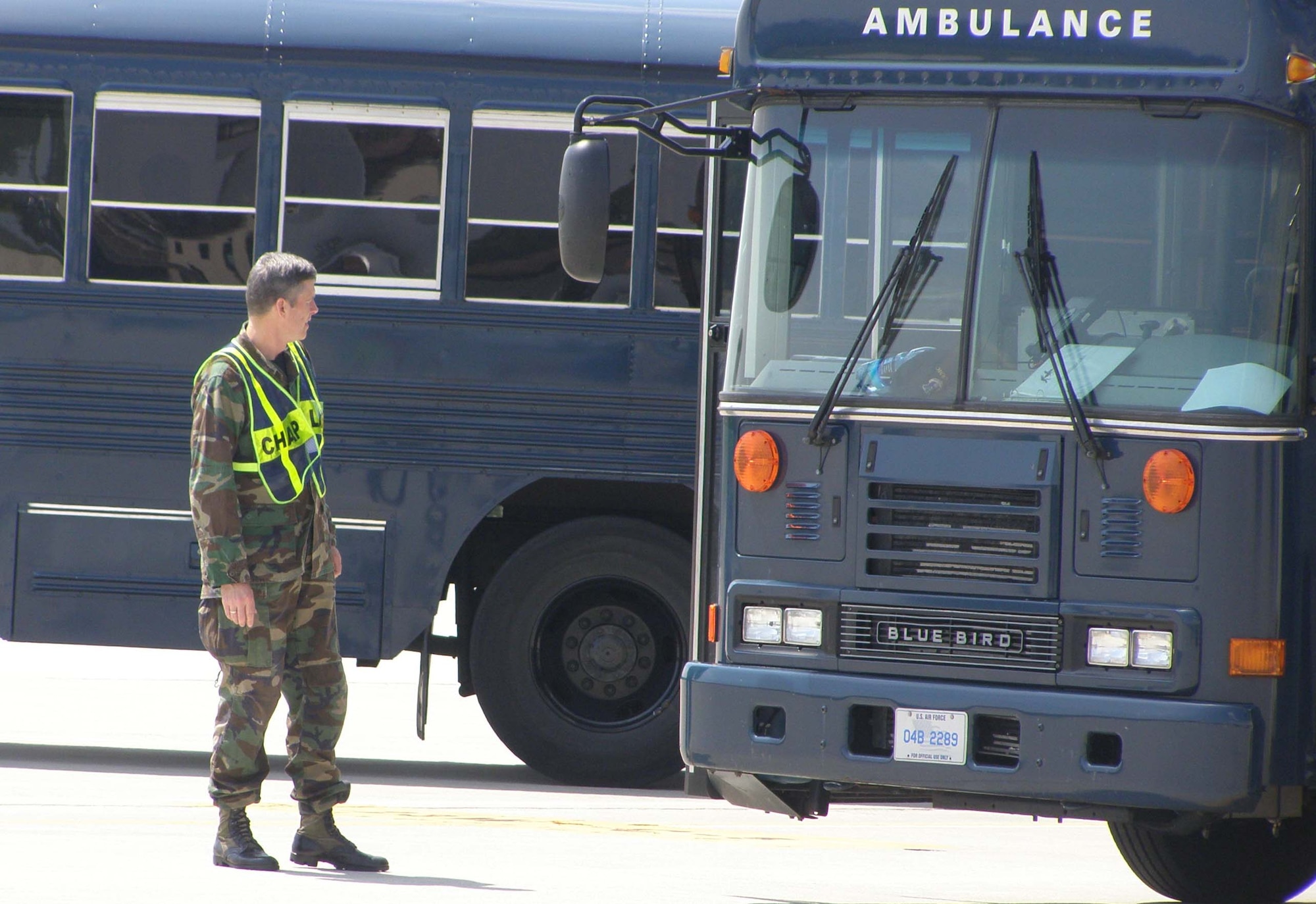 RAMSTEIN AIR BASE, Germany -- Chap. (Maj.) Henry Close, 86th Airlift Wing chaplain, waits on the ramp for wounded servicemembers returning from Kuwait June 14. Chaplain Close is assigned to the 435th Contingency Aermedical Staging Facility here. Air Force Reservist Staff Sgt. Vanessa Thomson, 459th Air Refueling Wing chaplain assistant, spent a two-week annual tour here to assist the chaplaincy at the CASF and the Ramstein North Chapel. (U.S. Air Force photo/Staff Sgt. Vanessa Thomson)