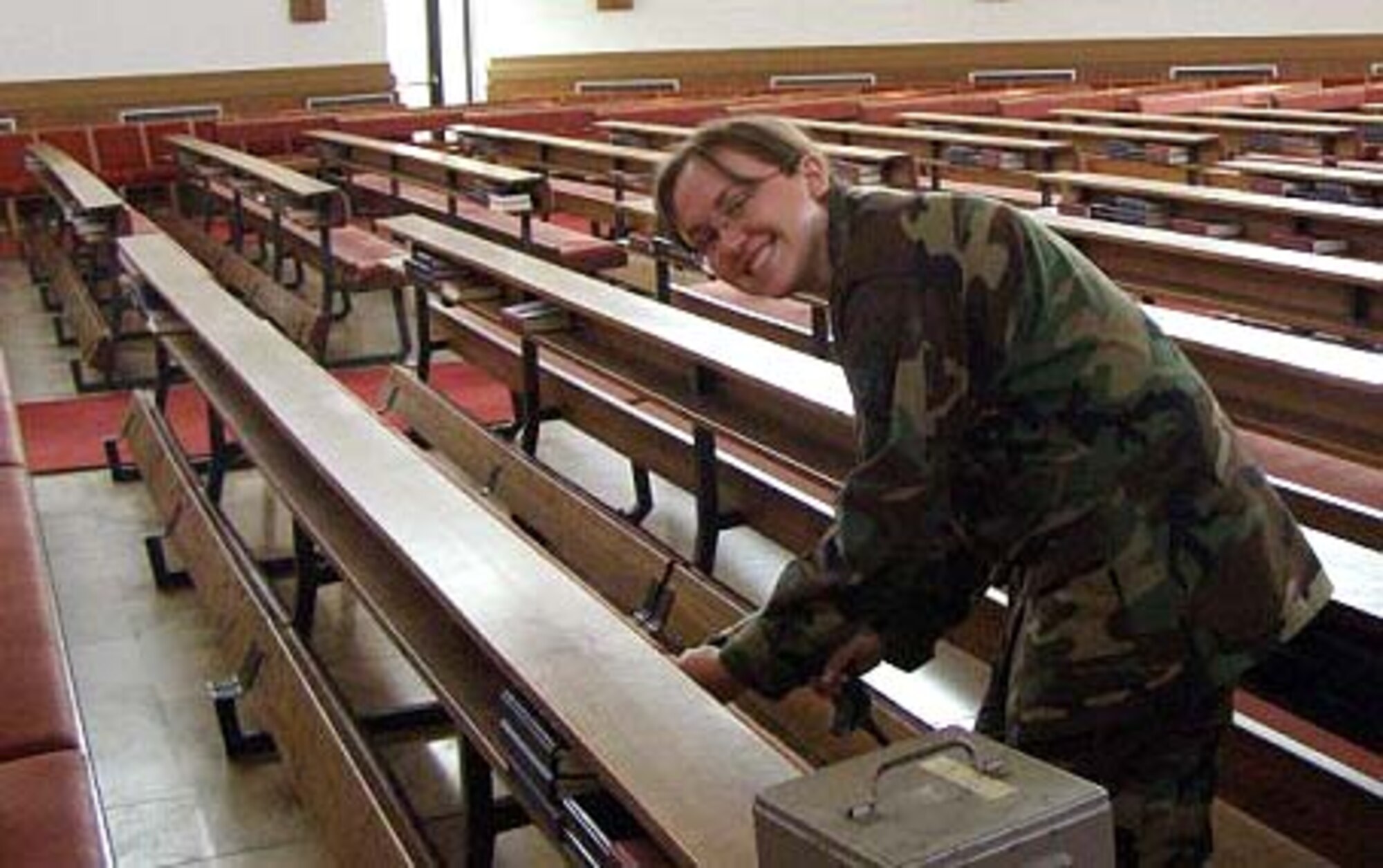 RAMSTEIN AIR BASE, Germany -- Staff Sgt. Vanessa Thomson, 459th Air Refueling Wing chaplain assistant, repairs a pew at the Ramstein North Chapel during a two-week annual tour here June 15. Sergeant Thomson is an Air Force Reservist who supported the 86th Airlift Wing chaplain staff and the 435th Contingency Aeromedical Staging Facility, where warriors returned home or continued on for further medical care. (Courtesy photo)