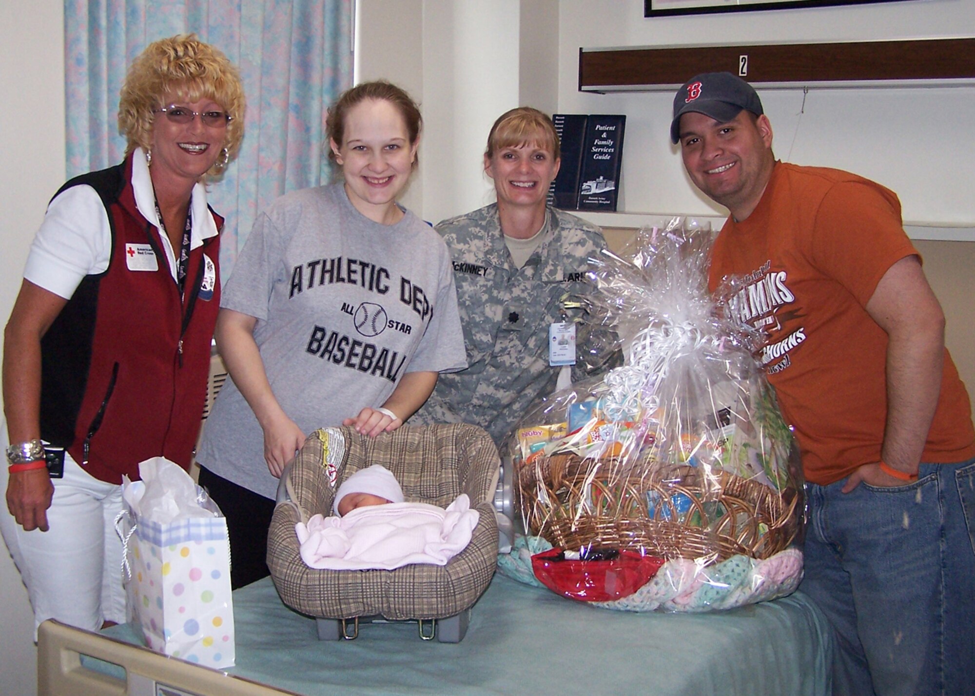 EIELSON AIR FORCE BASE, Alaska-- (From left) Margie Achman, American Red Cross station manager, Airman Jeanette Martinez, 354th Aircraft Maintenance Squadron, Army Lt. Col. Colette McKinney, Bassett Army Community Hospital chief nurse, and Airman 1st Class Francisco Martinez, 354th AMXS, pose for a picture with Baby Isabella Martinez June 15. Baby Isabella is the last baby to be born in the old medical facility, Bassett Army Community Hospital, at Fort Wainwright 4:43 p.m. June 15. The first baby born in the facility was born 53 years ago and was also of Air Force parents. (courtesy photo)