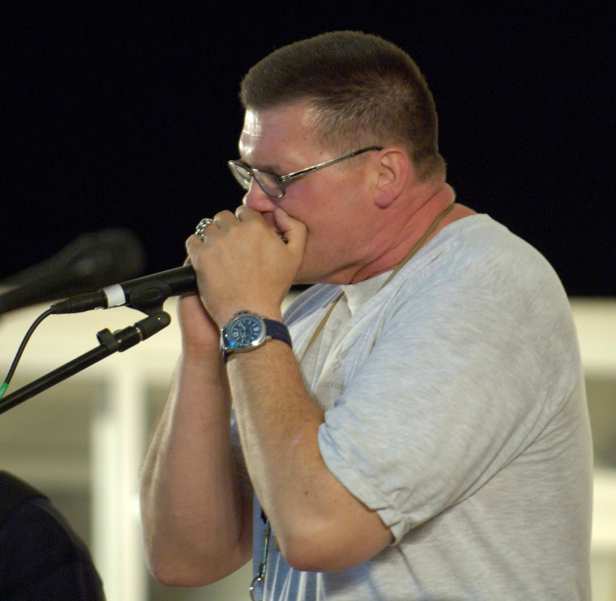 Senior Master Sgt. Omars Blaus sits in with the band.  Two U.S. Central Air Forces expeditionary bands that debuted under their new names "Live Round" and "Thunder Roll" held a combined kick-off concert for deployed servicemembers June 16 at an air base in Southwest Asia.  Sergeant Blaus is assigned to the Combined Air and Space Operations Center. (U.S. Air Force photo/Master Sgt. Jim Varhegyi)
