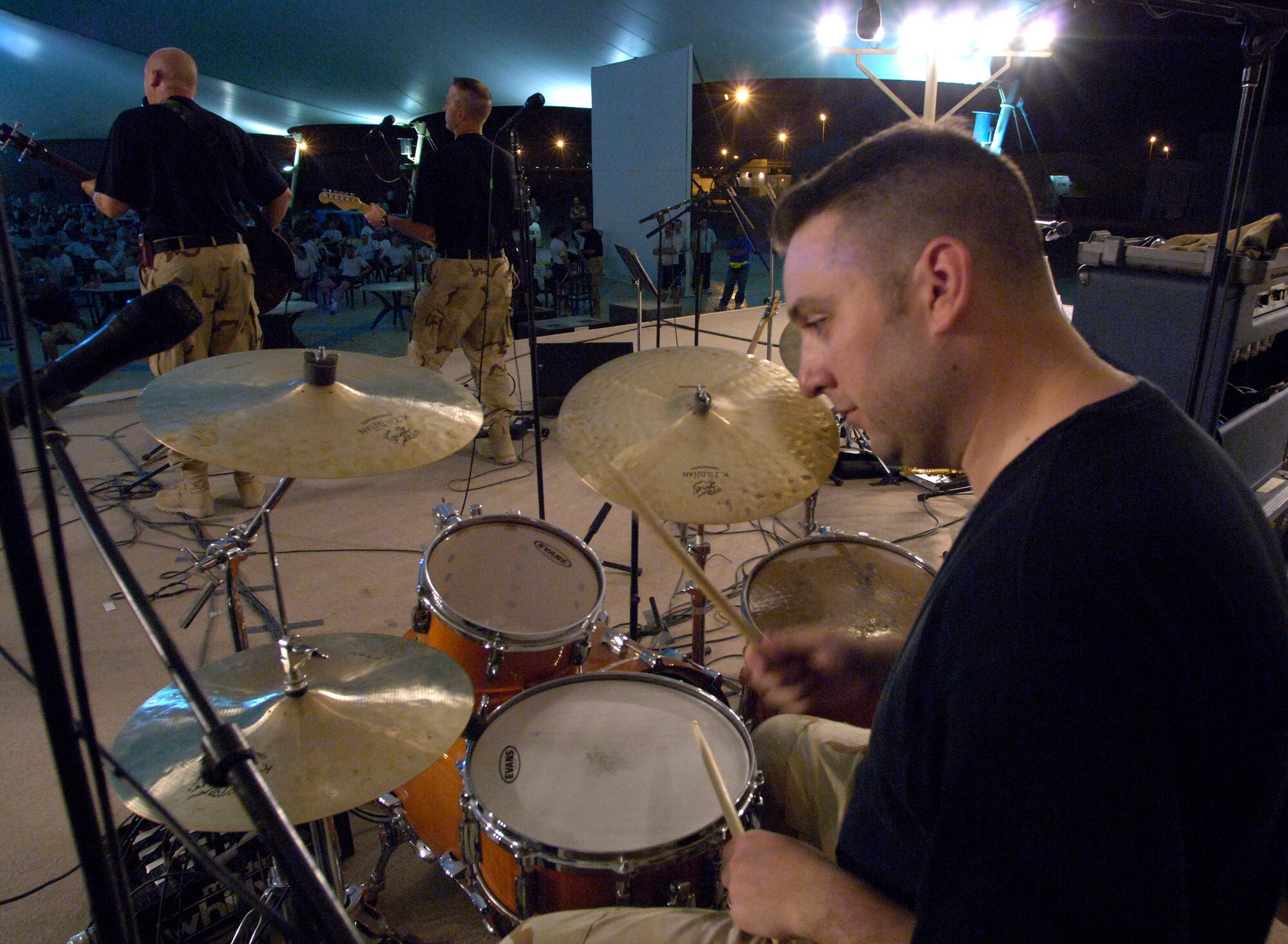 Staff Sgt. Joe Filipek of the U.S. Central Air Forces Expeditionary Band "Thunder Roll" performs at a concert in Southwest Asia June 16. "Thunder Roll," along with a second CENTAF band, "Live Round," are bringing a touch of home to servicemembers fighting the war on terrorism.  Sergeant Filipek is with the Illinois Air National Guard. (U.S. Air Force photo/Master Sgt. Jim Varhegyi) 